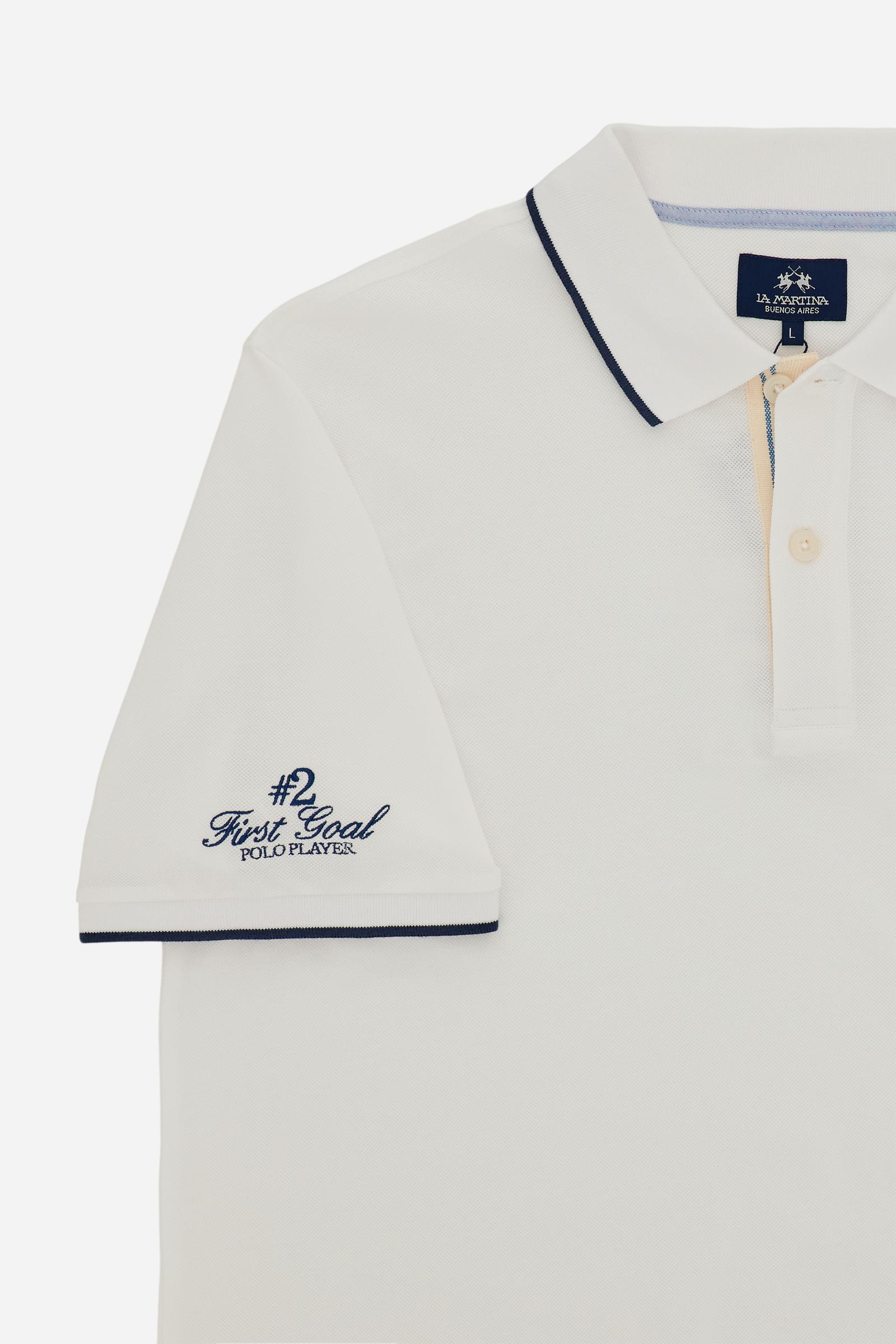 Piqué cotton polo with classic collar and contrast details. Graphic embroidery on chest and sleeves, including the “Academy Polo Club” crest. Modern clean fit. - Optic White
