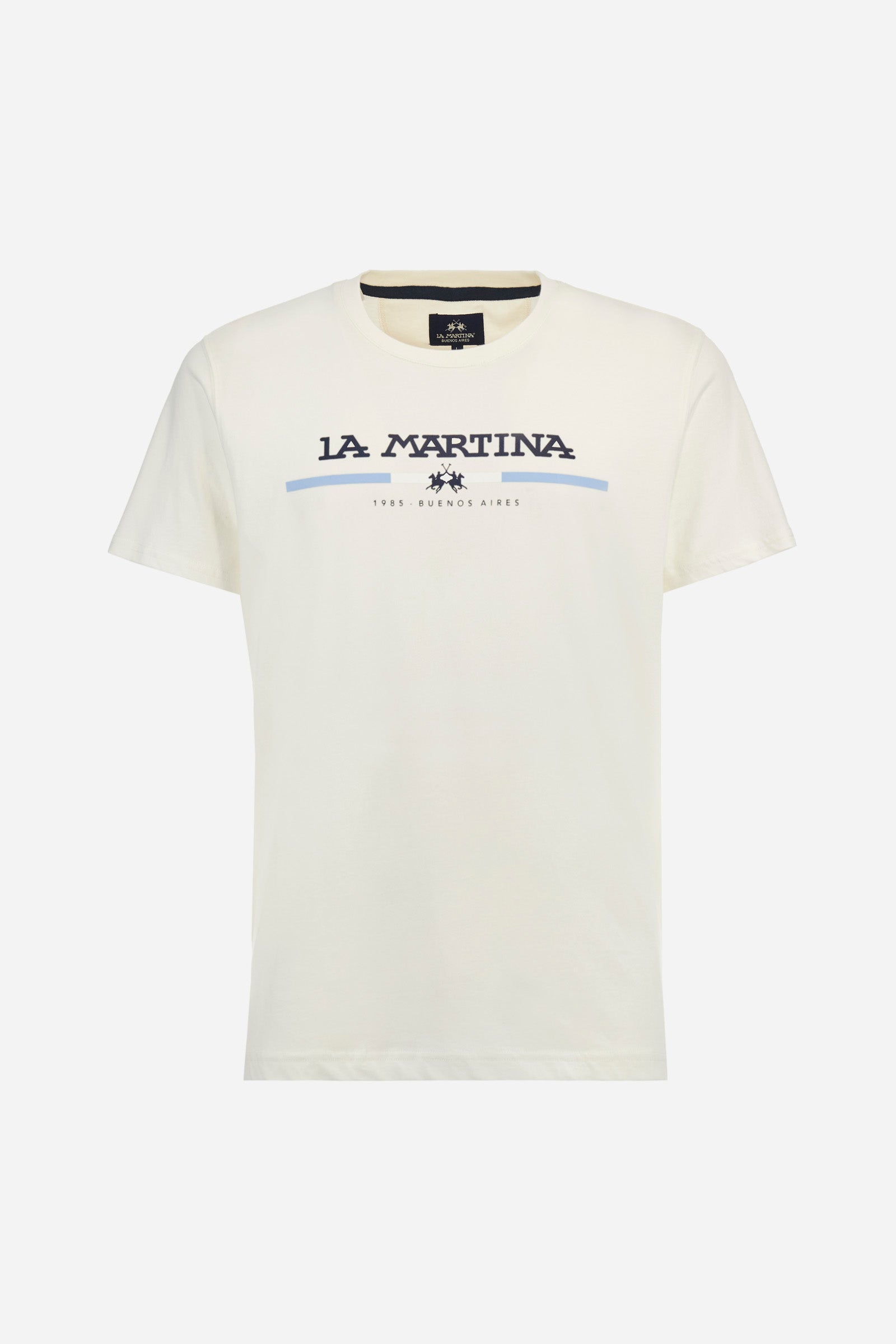 Men's single-colour short-sleeved crew-neck T-shirt, made of 100% cotton. The front features La Martina lettering and the logo with a strip of colour representing the flag of Argentina. Regular fit. The model is wearing a size L. - Off White
