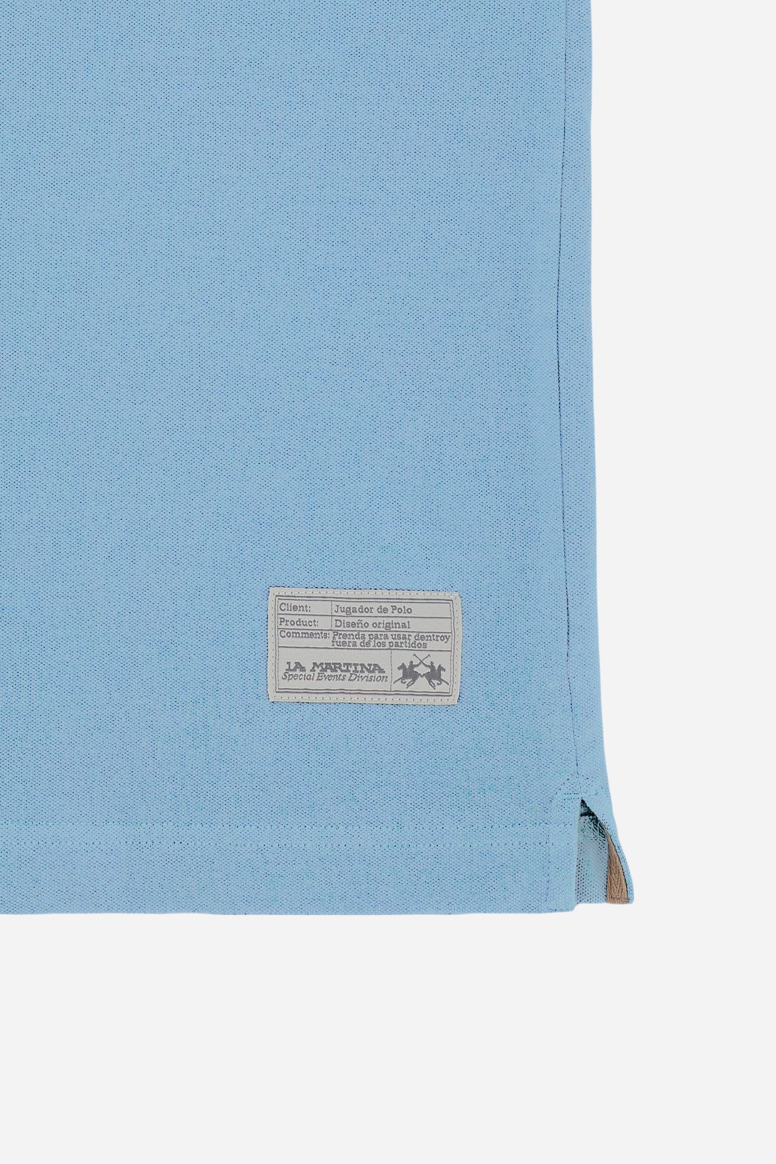 Men's short-sleeve polo shirt made from solid-color stretch piqué fabric. The model features a two-button front placket with ribbed collar and cuffs in matching tone. An iconic design of the brand, it stands out for the large embroidered team logo in contrasting color on the chest and the bold brand print under the collar in contrasting color. The regular fit ensures comfort and versatility for everyday wear. The model is wearing size L. - Stone Blue