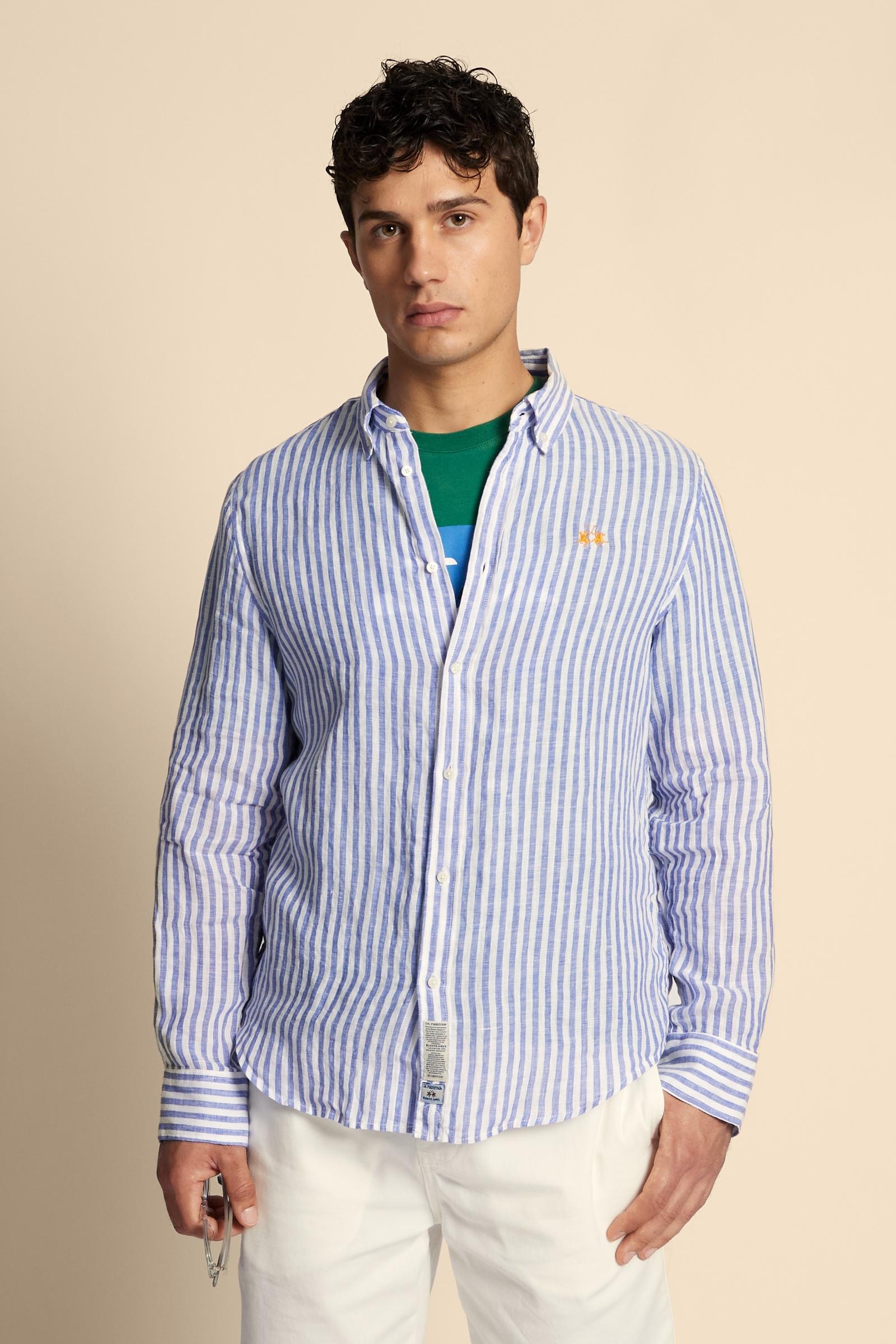 Men’s long-sleeve shirt crafted from 100% linen fabric with two-tone vertical stripes. Regular fit ensures comfort and versatility, complemented by a button-down collar and custom buttons. The iconic contrast embroidered logo on the chest signs the design with understated elegance. The model wears size L. - OptWhitePrincessBlue