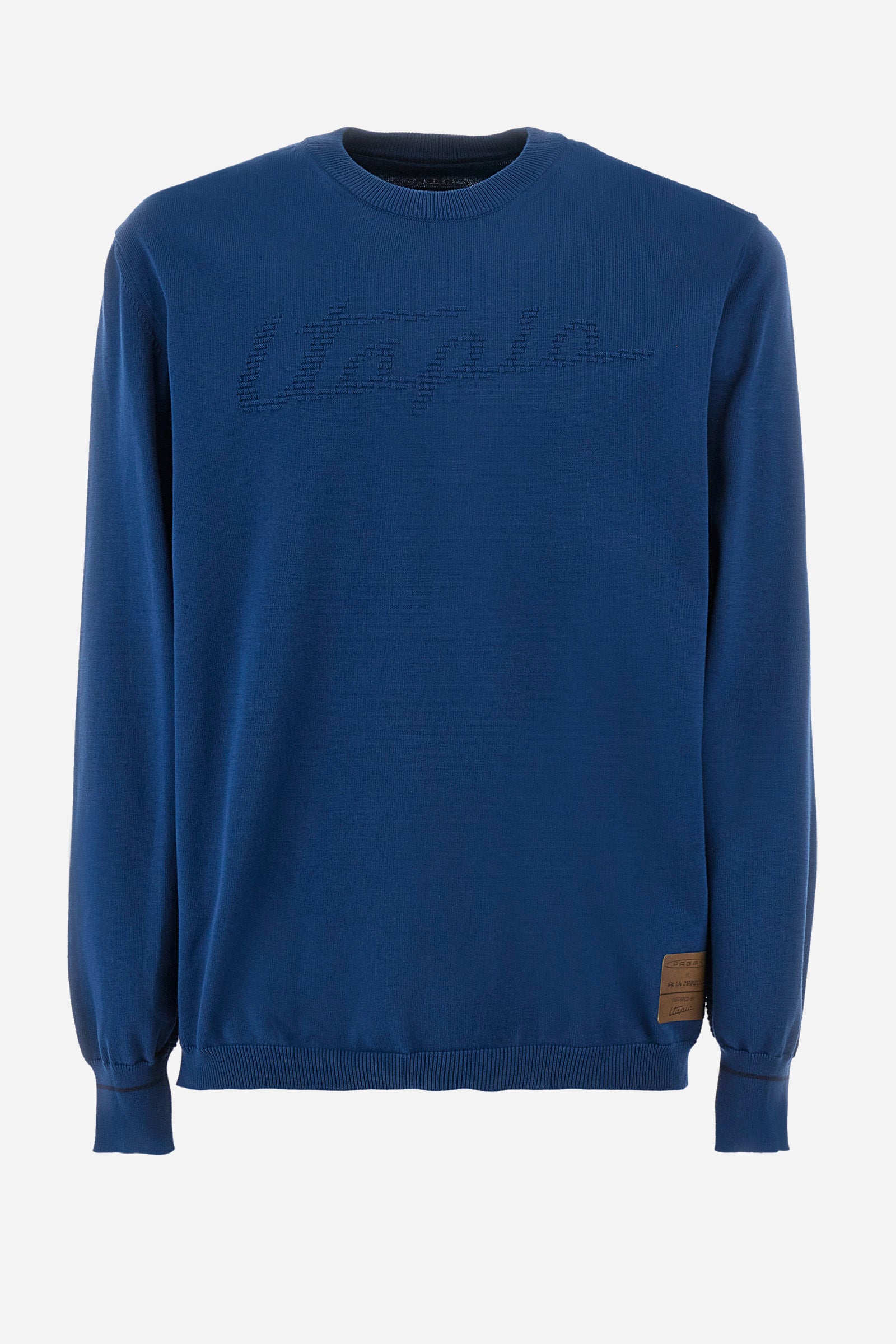 Men's long-sleeved crew-neck jumper in a single colour in collaboration with Pagani. Made from 100% cotton. Some parts of the garment have a woven basket stitch texture. Ribbed cuffs, neck and waist. The front features the line's characteristic lettering. The logo and "La Martina" and "Pagani" lettering are present on the patch representing the collaboration applied on both the front and back. The fit is regular. The model wears a size L. - Ensign Blue