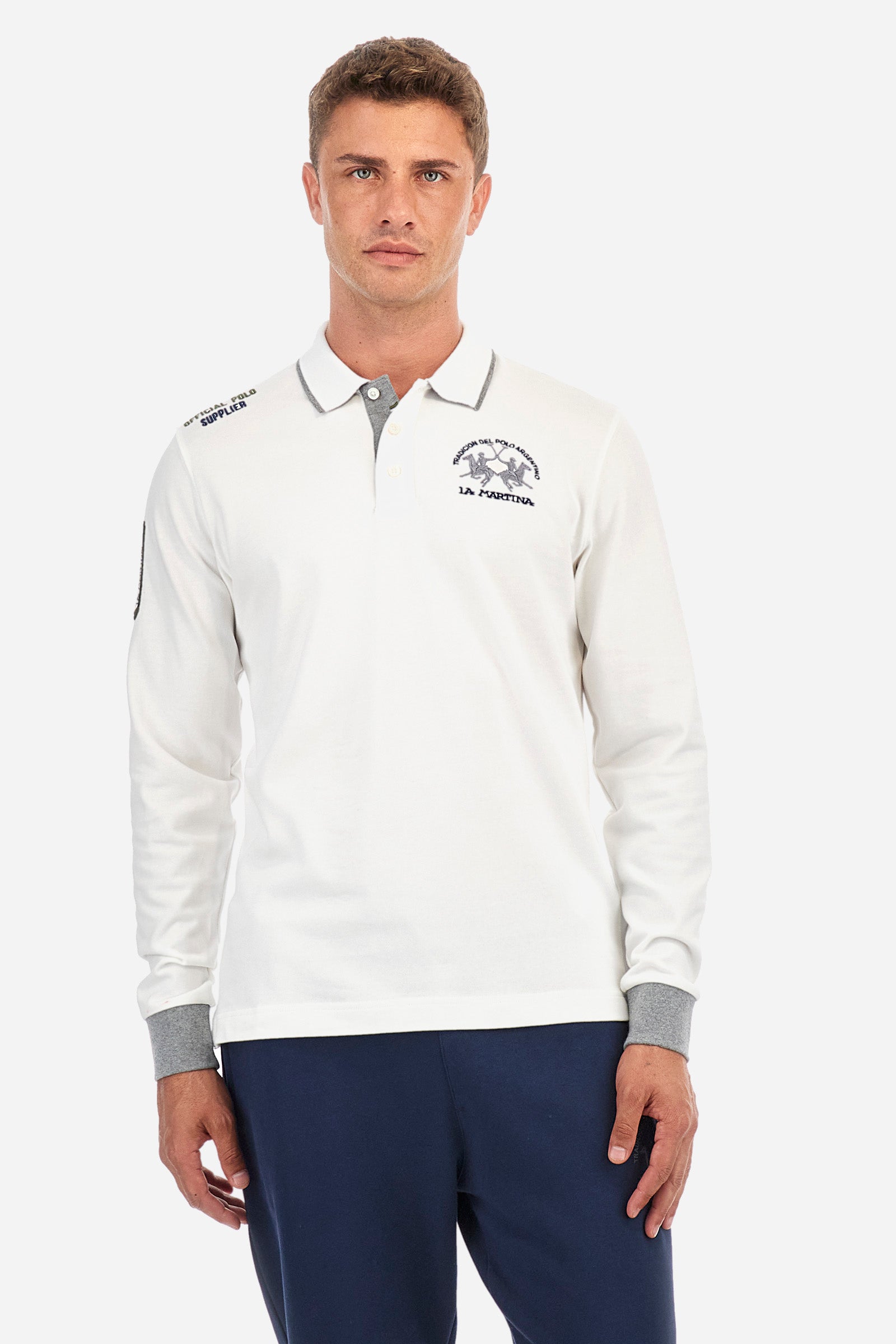 Men's single-colour long-sleeved polo shirt, made from 100% cotton. Three-button fastening. Profiled collar, with the brand's initials underneath. Colour-contrasting cuffs. The garment features all-over lettering and symbols. The logo is embroidered on the front. Regular fit. The model is wearing a size L. - Off White