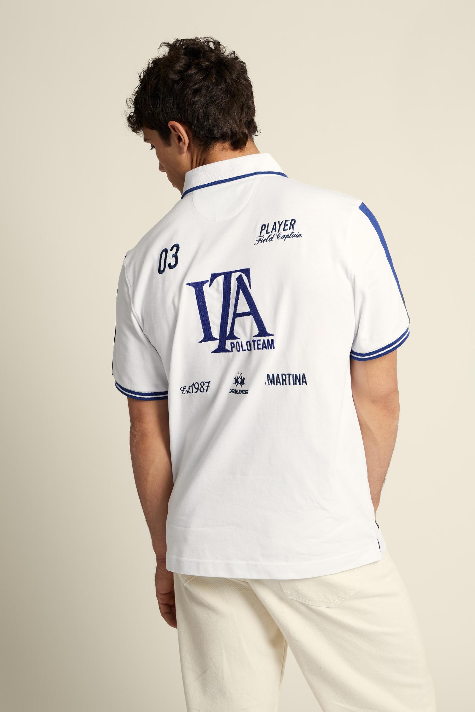 Men's short-sleeve polo in 100% cotton jersey featuring bold Italia graphics, contrast piping, and a contemporary fit. Perfect for a stylish, sporty look. - Optic White