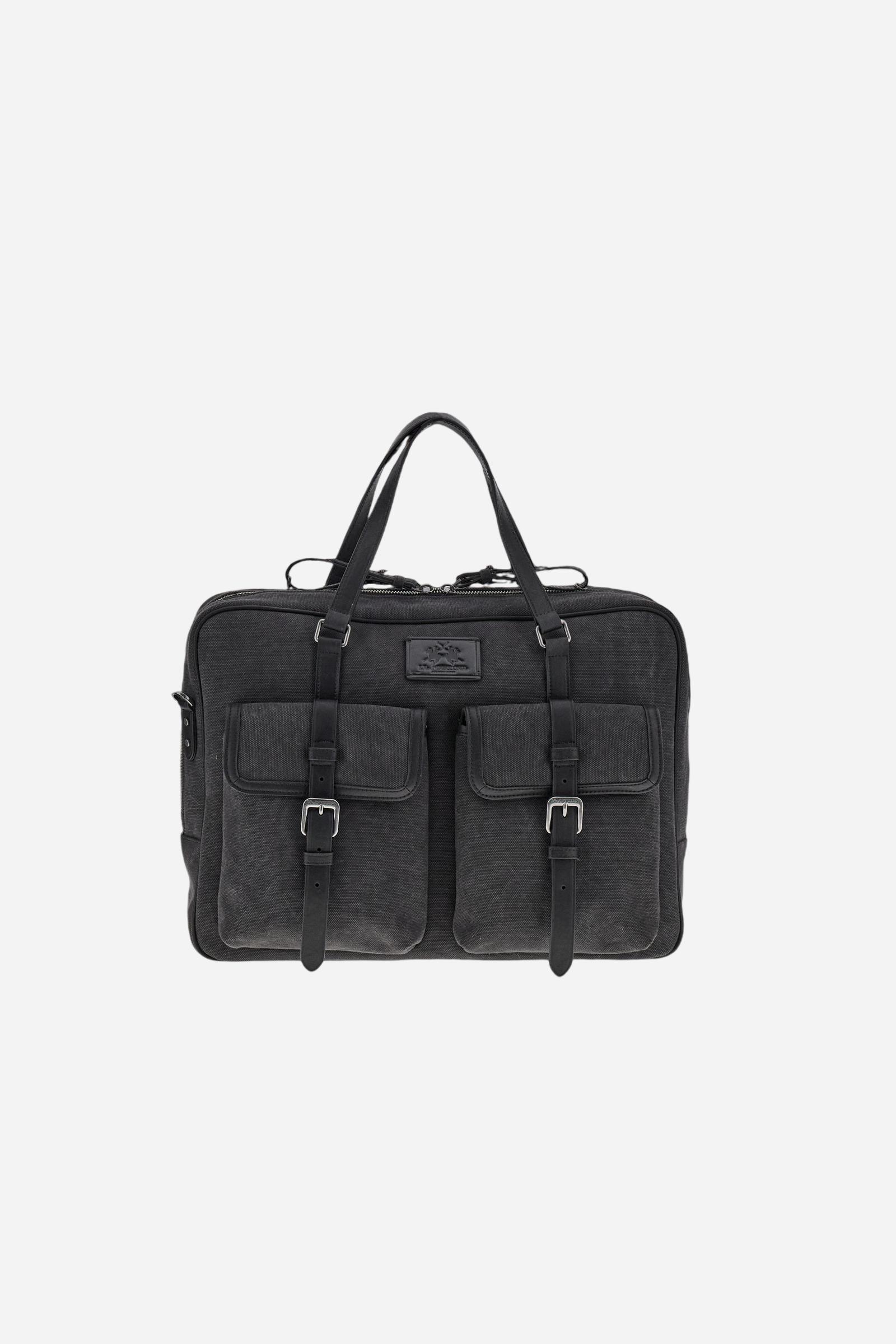 Semi-rigid work bag in washed canvas with smooth leather details, practical and roomy, ideal for work and daily commuting. Closed with a top zip, it includes a detachable shoulder strap and multiple pockets for added functionality. The hot-stamped logo on the leather tag completes the model. Dimensions:40 x 31 x 9 - Black