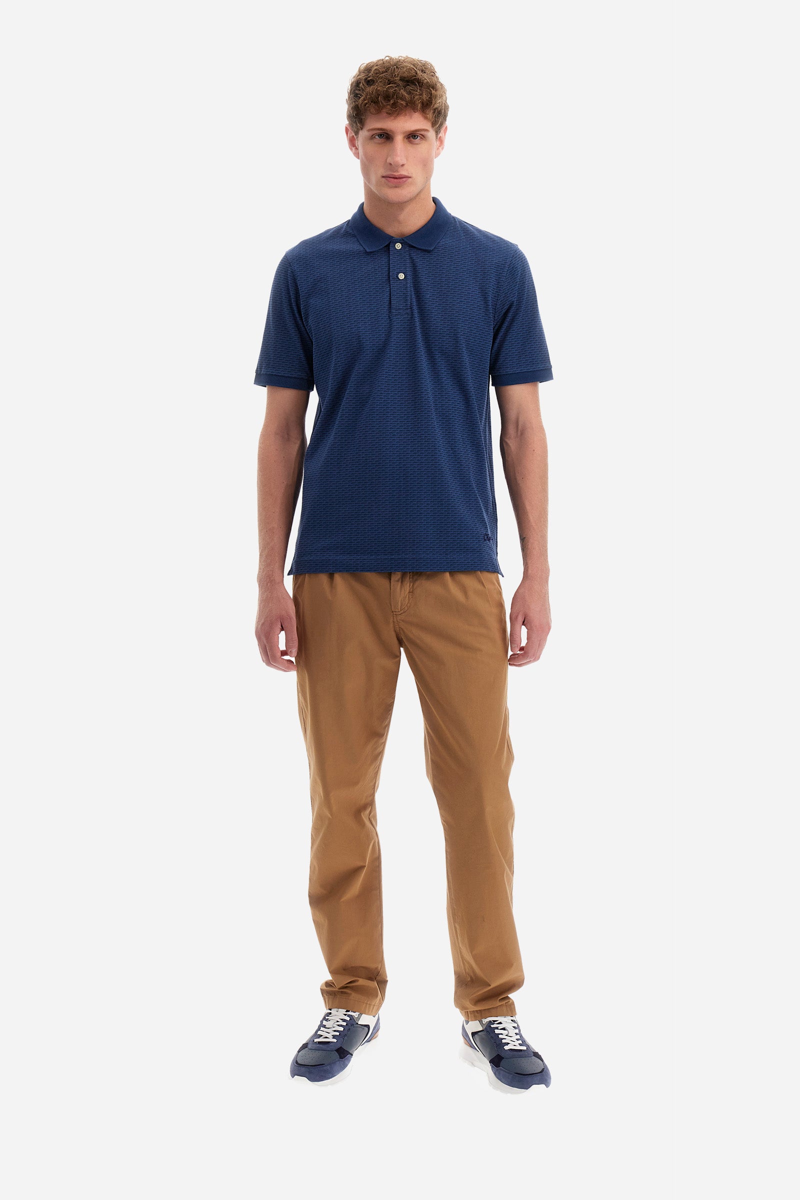 Single-colour men's polo shirt with short sleeves from the line in collaboration with Pagani. Made of stretch cotton. Two-button fastening. The collar and armholes feature a different texture. The garment features lettering throughout. A patch with the brand's name and logo and the word "Pagani" is applied on the back. The fit is regular. The model wears a size L. - ENSIGNBLUE/NAVYBLAZE