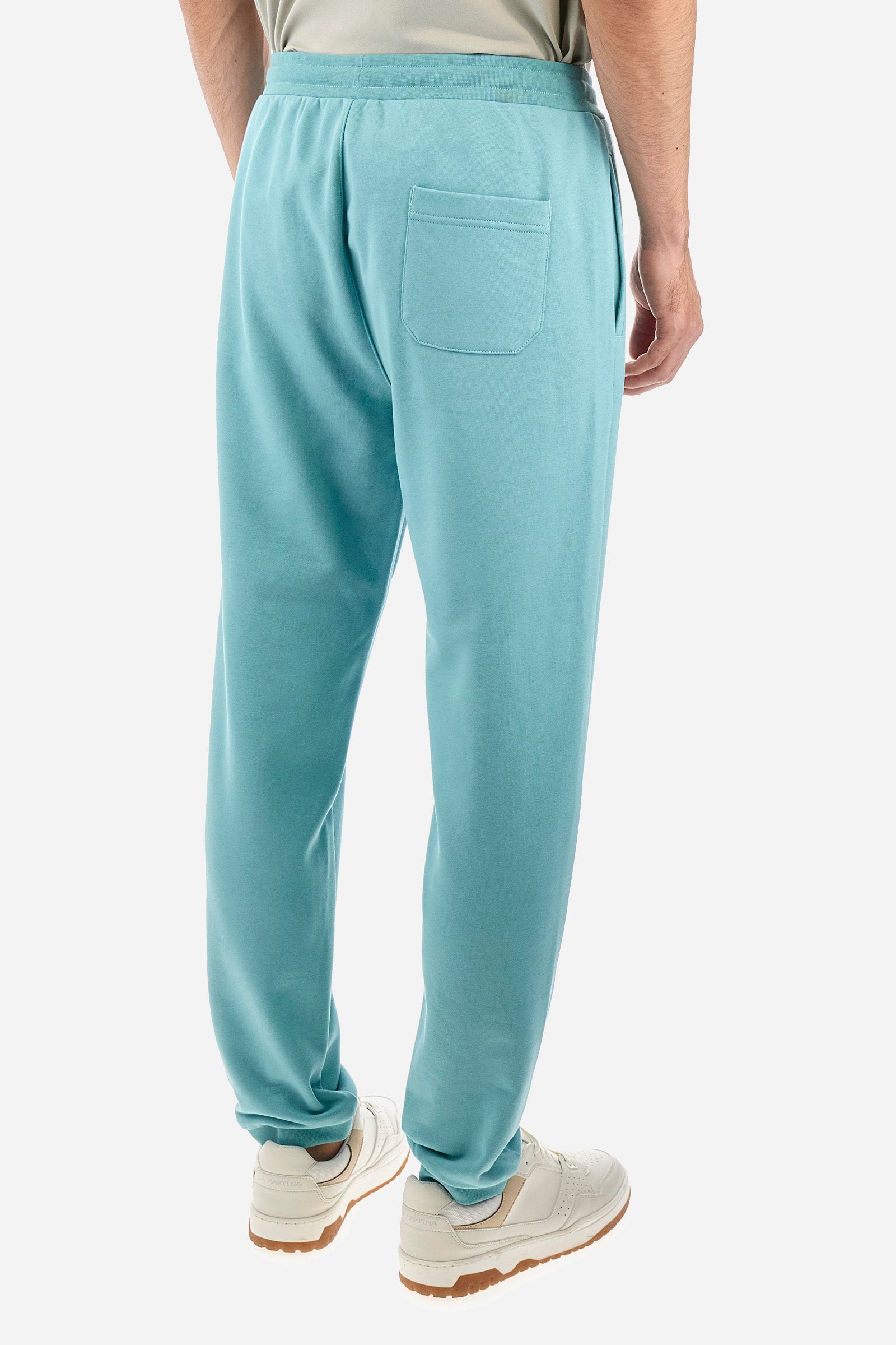 Men's single-colour jogging bottoms in a cotton sweat fabric from the Polo Academy line. With a drawstring waist and double front pocket. Another pocket is present on the back. The logo is present on a patch applied under one of the front pockets. The fit is regular. The model wears a size L. - Aquifer