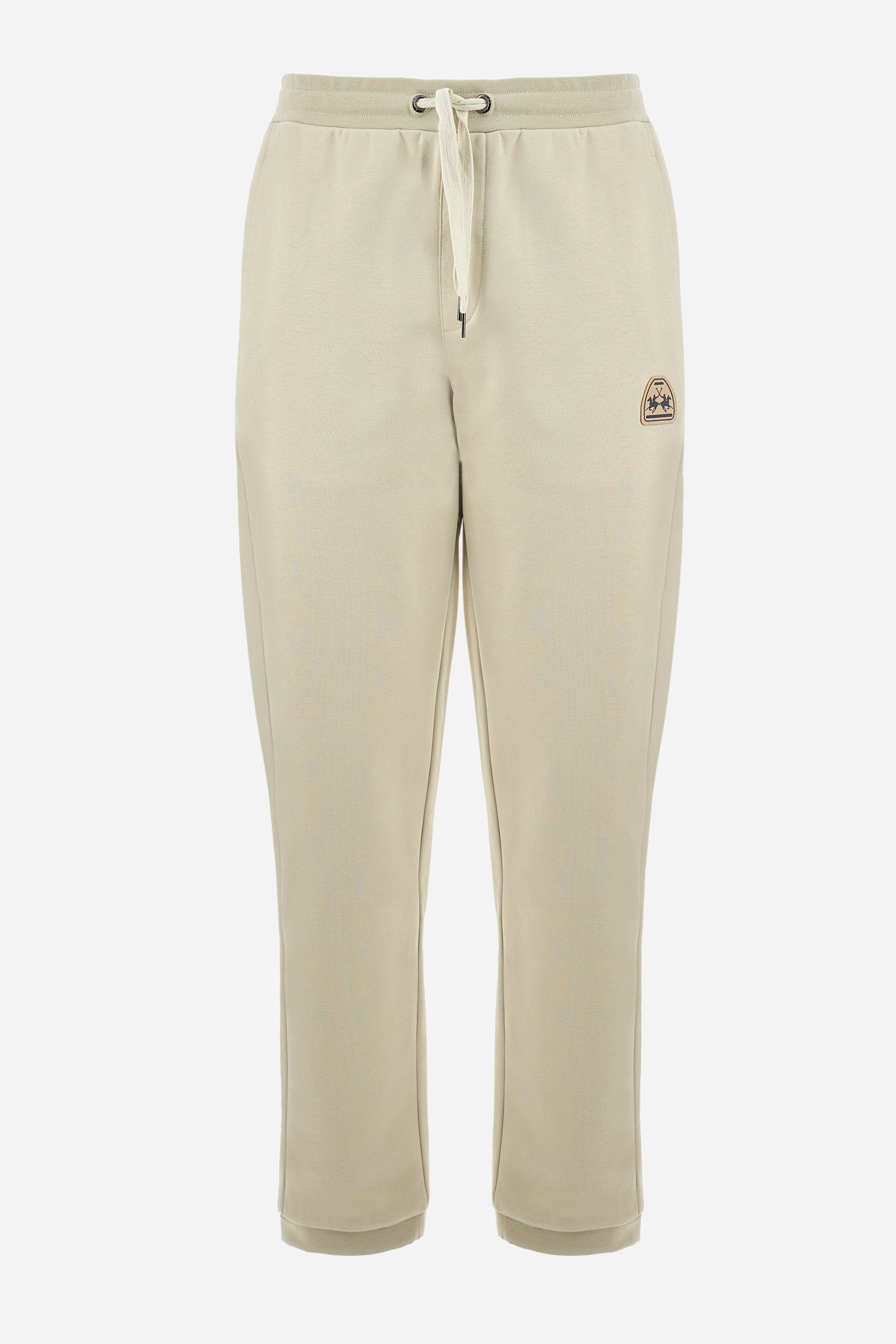 Men's single-colour jogging bottoms in a cotton sweat fabric from the Polo Academy line. With a drawstring waist and double front pocket. Another pocket is present on the back. The logo is present on a patch applied under one of the front pockets. The fit is regular. The model wears a size L. - Bone White