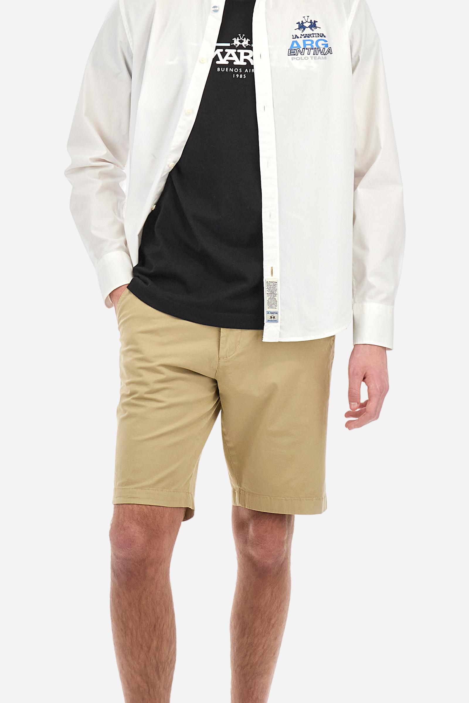 Men's solid color T-shirt, made of cotton jersey. Crew neck. The front features the La Martina text in print. The logo is embroidered on the front, in the center of the chest. The fit is regular. The model is wearing size L. - Black