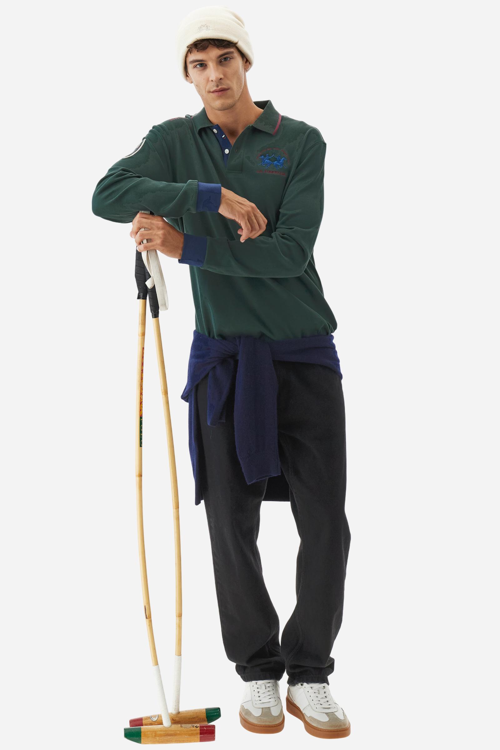 Men’s long-sleeve polo shirt in solid-colour cotton jersey with a warm, matte handfeel. Ribbed collar and cuffs with stripes and colour blocks in contrast, two personalised buttons and contrast details inside the collar. Patches and graphics on sleeves and chest celebrate the Official Polo Supplier team. The large multicolour logo is embroidered on the chest. Regular fit. The model wears size L. - Sycamore