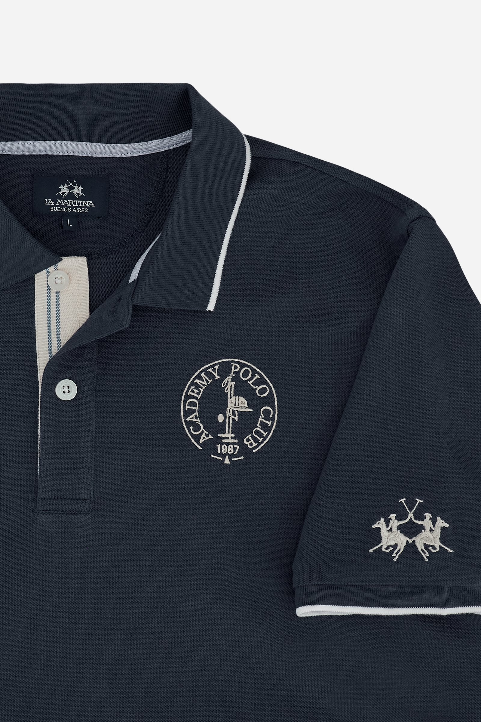 Piqué cotton polo with classic collar and contrast details. Graphic embroidery on chest and sleeves, including the “Academy Polo Club” crest. Modern clean fit. - Navy