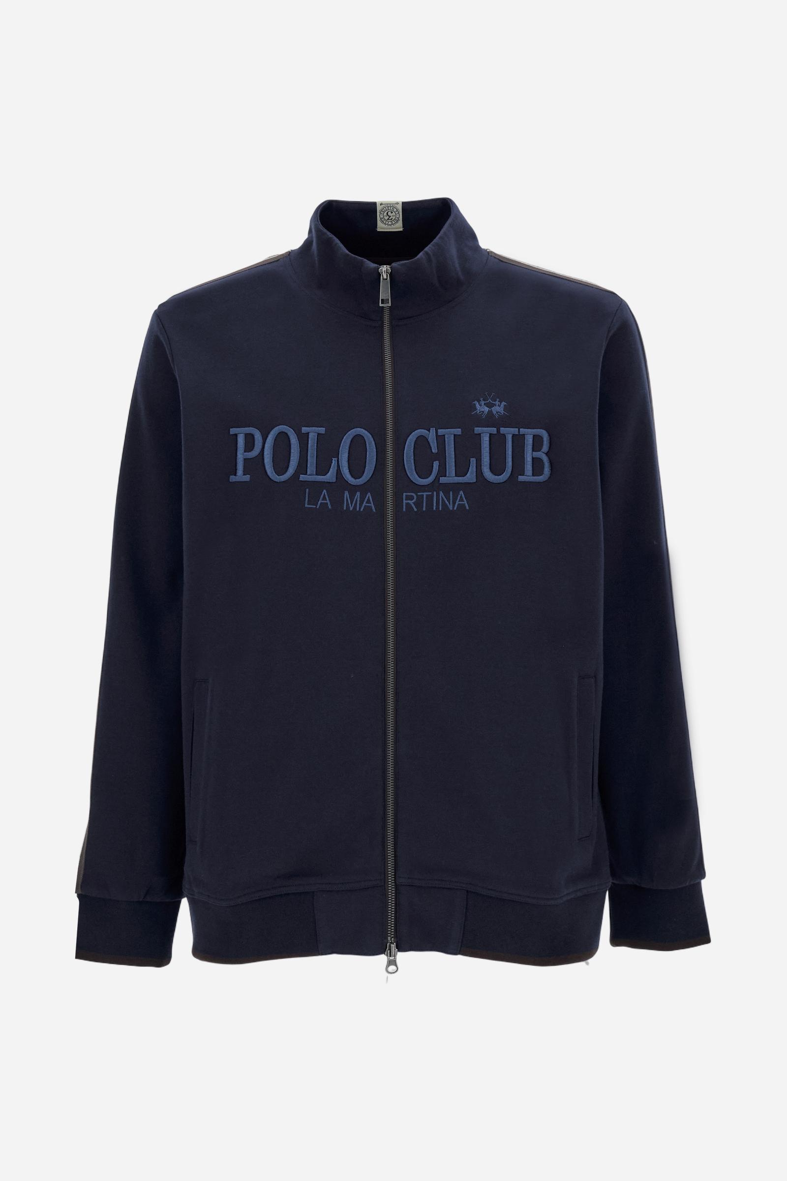 Men's long-sleeved, full-zip sweatshirt. Made of soft solid colour cotton fleece. The neck and cuffs and waistband are in solid colour ribbed knit with contrasting edging. Front zip opening and Polo club guarantee label applied to the edge inside the collar. The front lettering is a large tone-on-tone raised embroidery. A narrow two-tone striped band is applied to the shoulders and sleeves. Regular fit. The model is wearing a size L. - Navy