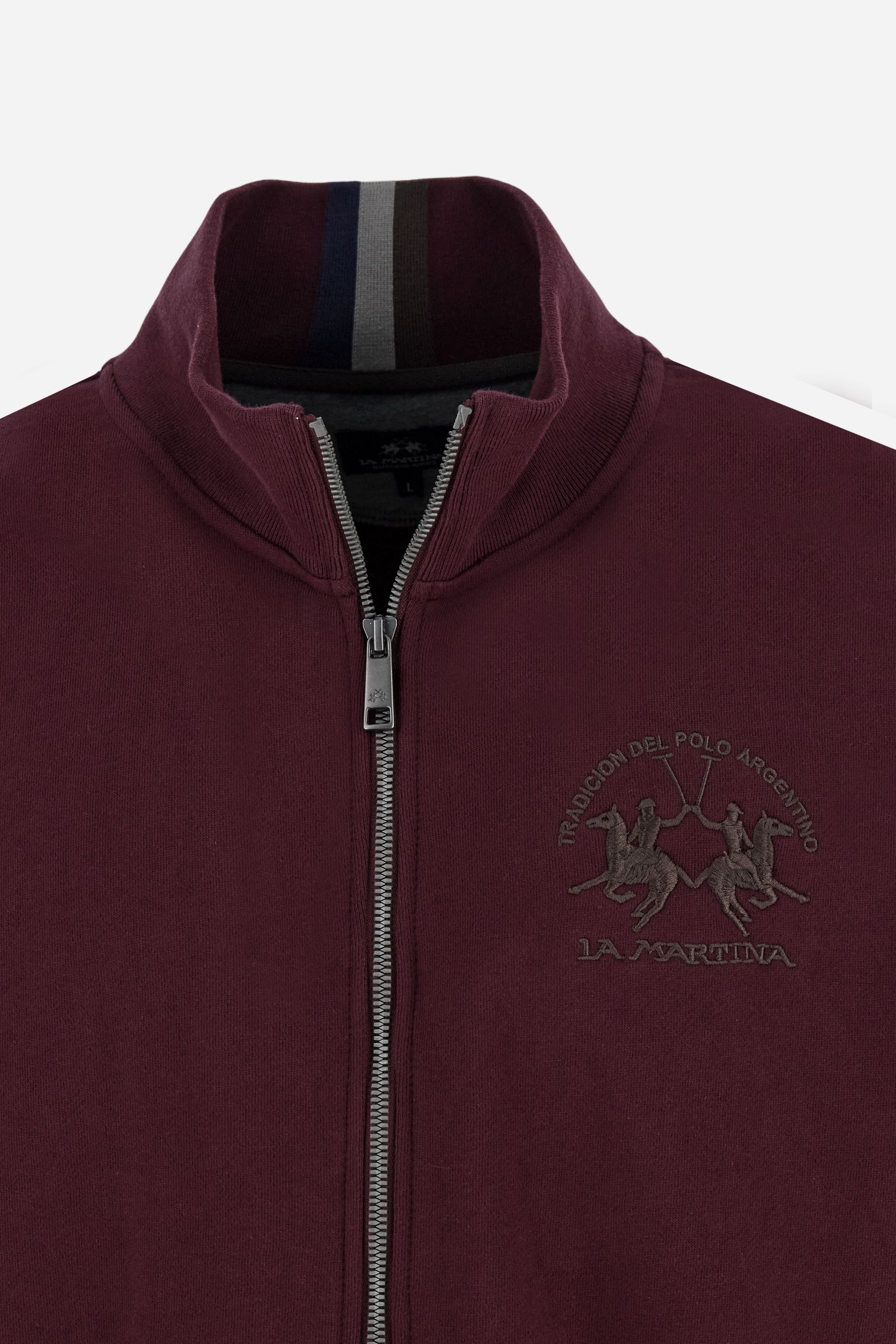 Men's long-sleeved solid colour sweatshirt. It is made of comfortable 100% cotton fleece with a soft-brushed feel. Model with high ribbed neck and front zip opening. Solid colour ribbed cuffs and waistband. The large contrasting brand team logo is embroidered on the chest. A contrasting colour fabric number patch is applied to the right sleeve. The model has a regular fit that offers a comfortable, relaxed silhouette. The model is wearing a size L. - Port Royale