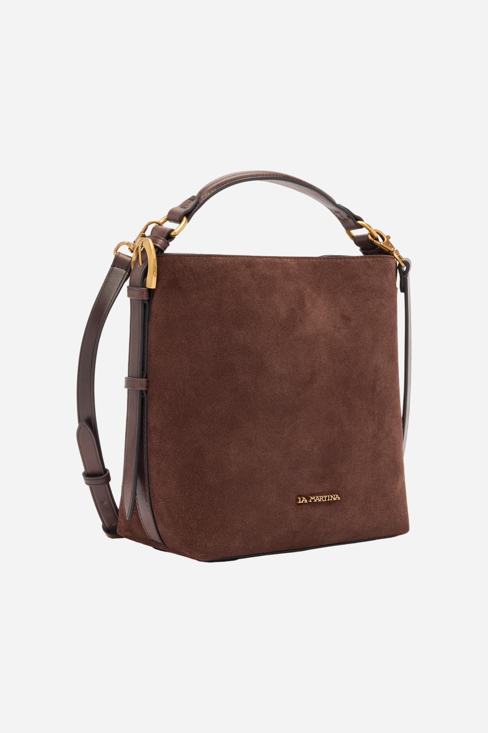 Compact square-shaped tote bag crafted from soft solid-colour suede. Featuring a structured top handle and a detachable leather shoulder strap. Gold-tone metal details and a front logo plaque complete the elegant, understated design. Dimensions:22 x 23 x 11 - D.BROWN/D.CHOCOLATE