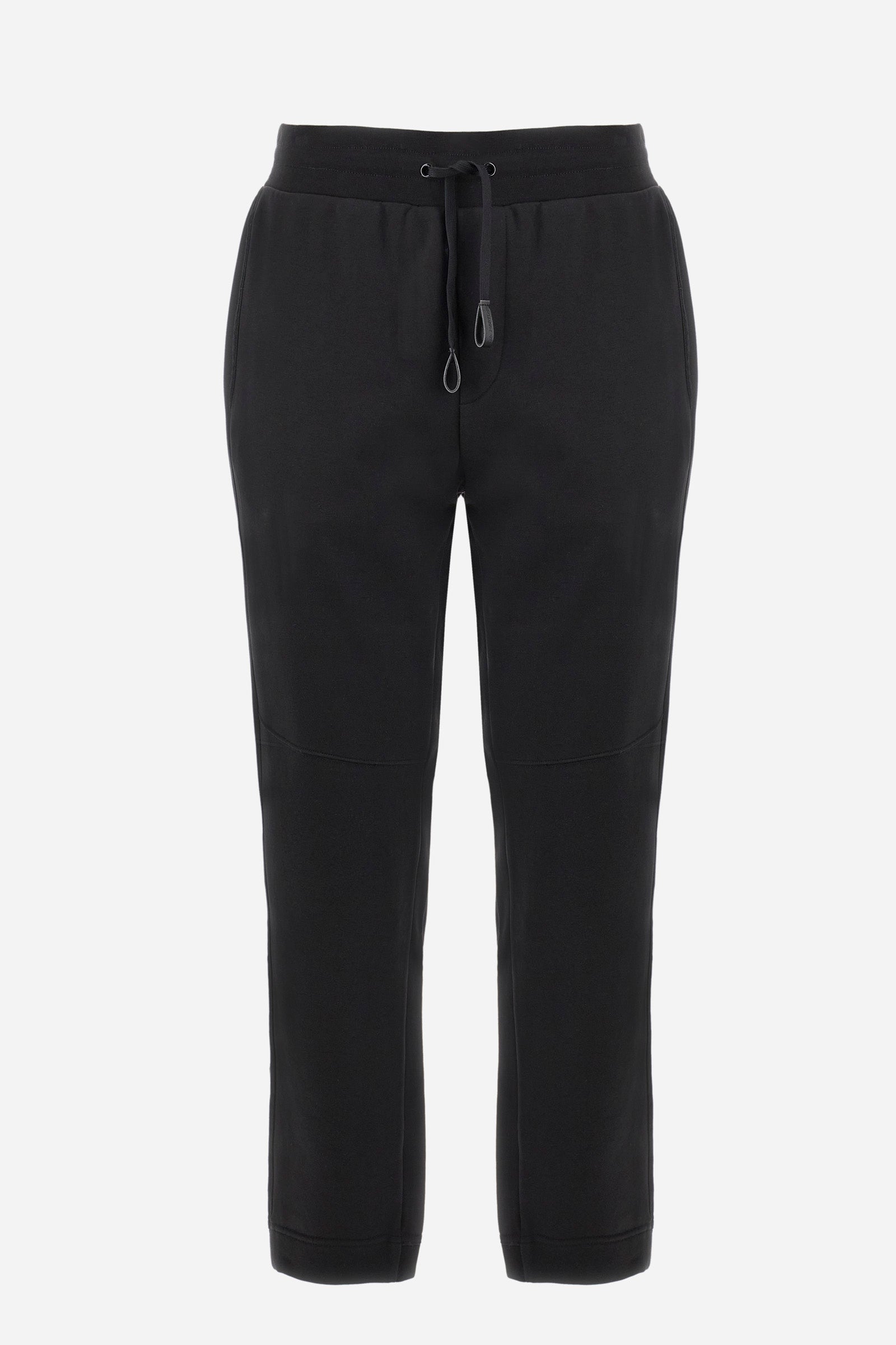 Men's single-colour jogging bottoms in a cotton sweat fabric. With a drawstring waist and double front pocket. With different shades at the bottom of the leg. On the back there is a pocket with a zip fastening featuring contrasting textures and colours. The logo is present on the tag sewn on the back pocket. The fit is regular. The model wears a size L. - Black