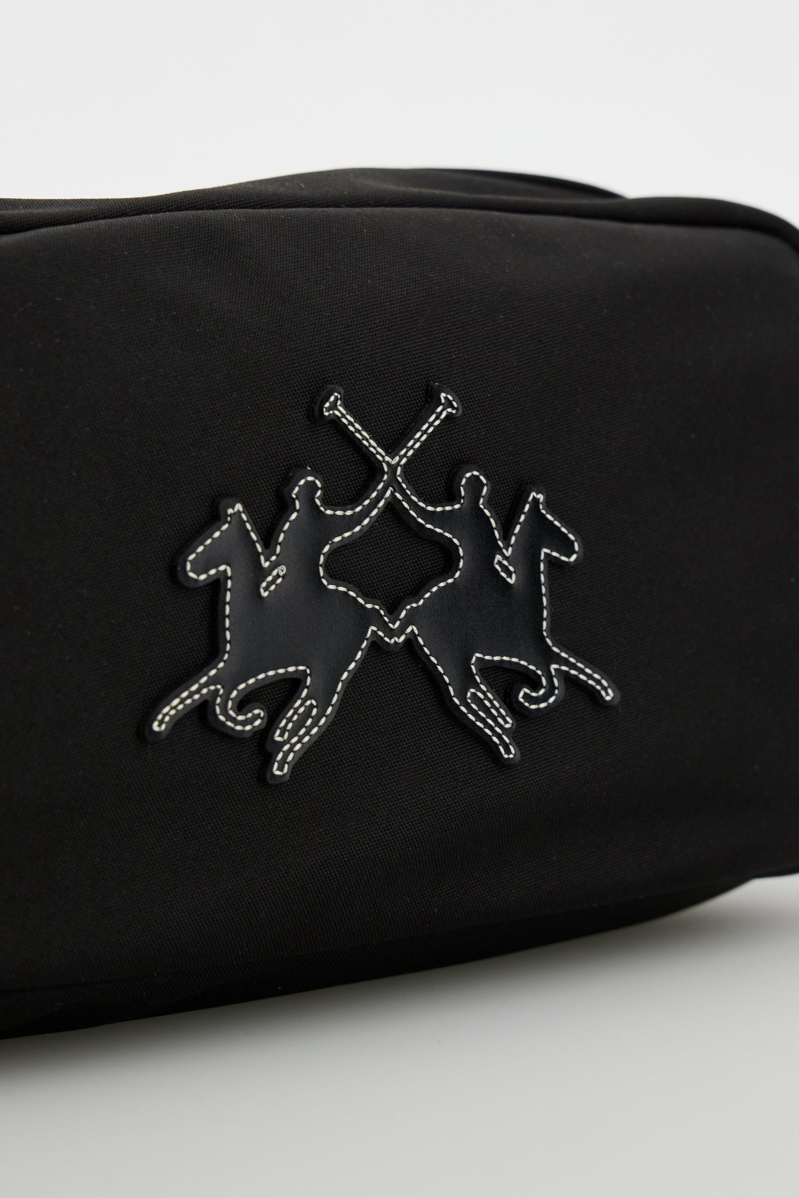 Travel case in matte technical canvas with eco-leather details, double zip compartment and maxi logo on the front. - Black