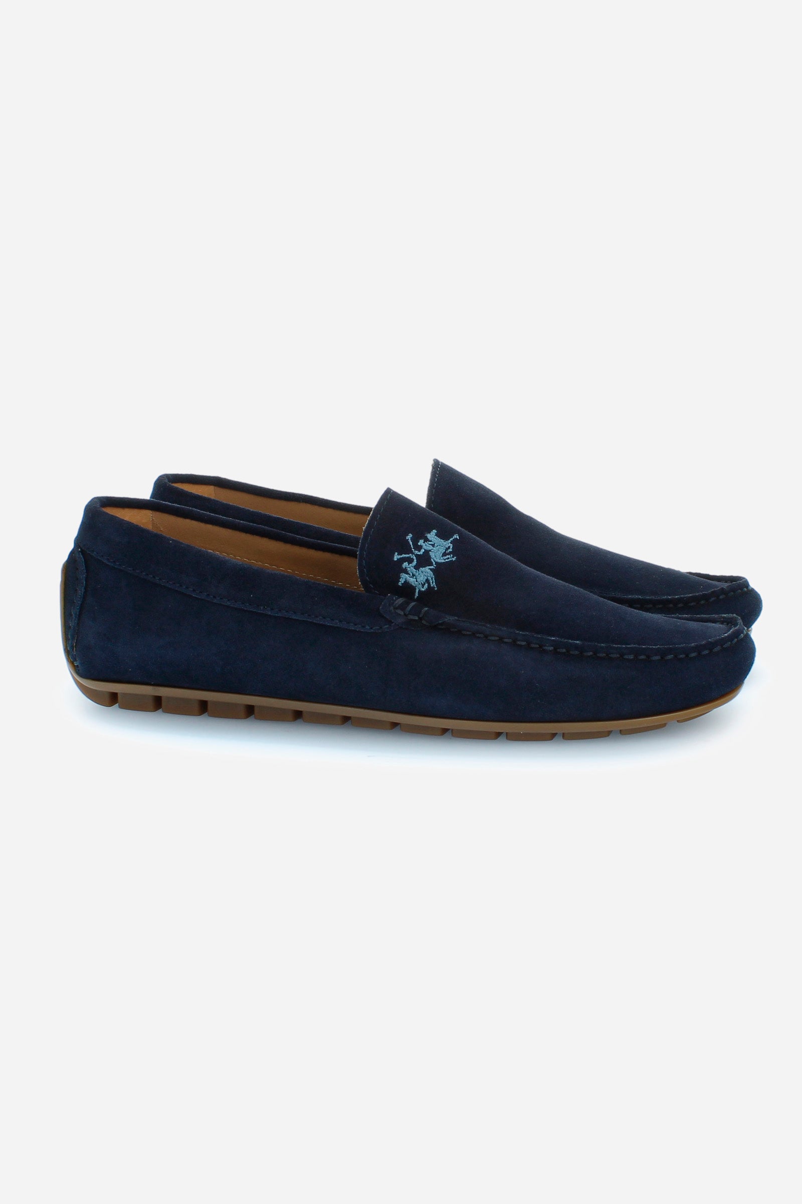Men's loafers in soft suede for the summer season. Made using the tubular technique to give the model softness and flexibility. The full-colour suede is delicately punctuated by the embroidery of the logo in a contrasting colour on the faceplate and the hand-stitched ends of the faceplate. For both leisure and informal occasions, helping to create a sporty yet refined look. - BLUE