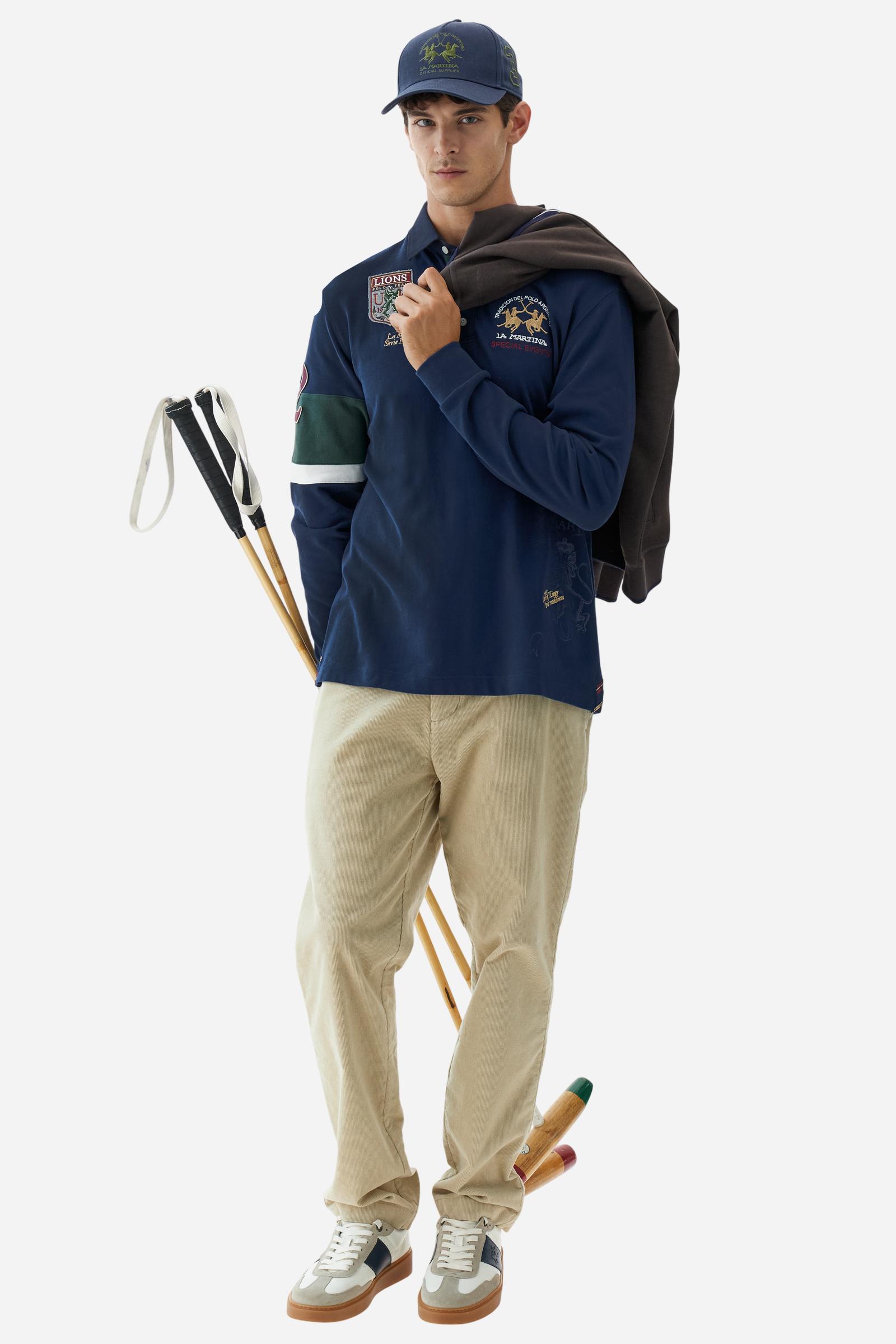 Long-sleeve polo shirt in 100% cotton jersey, soft and warm to the touch. Gabardine collar in tone with a contrast placket for a modern look. The English flag is printed under the raised right collar tip. Contrasting fabric bands and a patch with number 2 decorate the right sleeve, evoking polo player uniforms. Multicolor graphics dedicated to the English team and past special events enrich the design, with a large team logo embroidered in two-tone on the chest. Regular fit. Model wears size L. - Navy