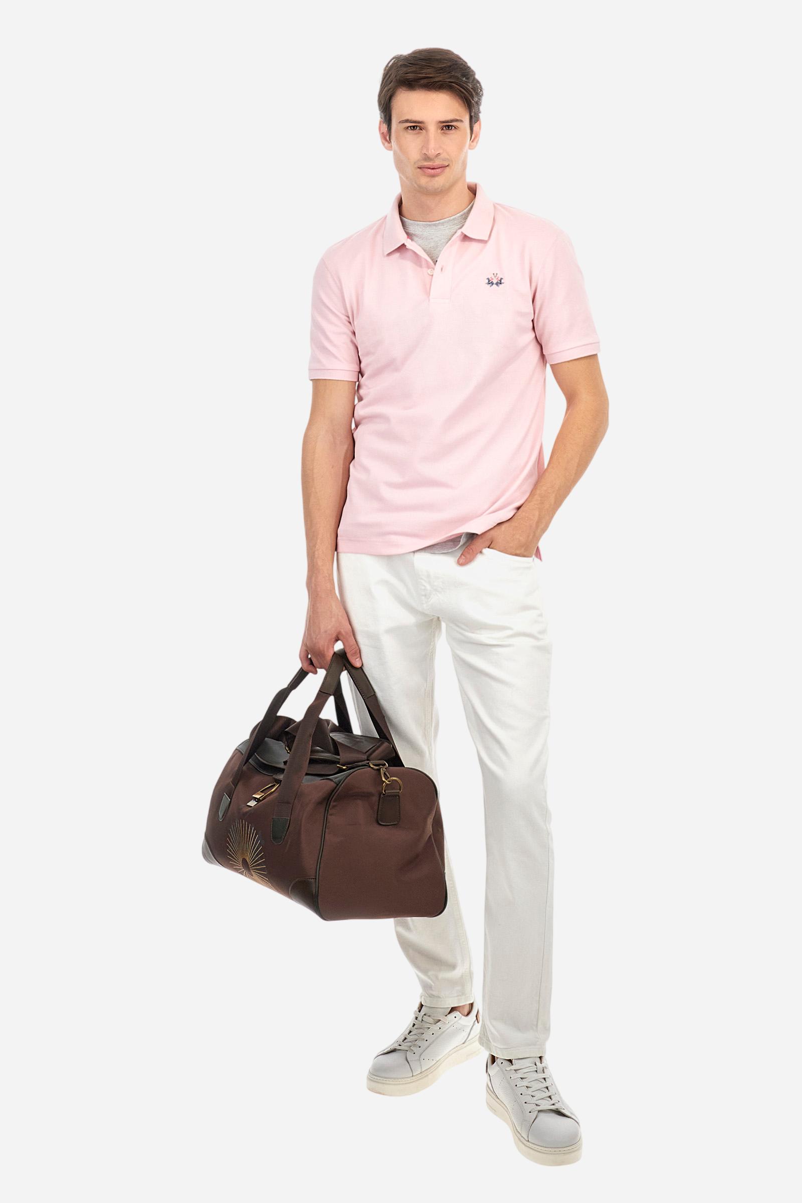 Men's plain short-sleeved polo shirt made from stretch piqué. Two-button fastening. The collar and cuffs are made from tone-on-tone ribbed fabric. Under the collar, there is a contrasting fabric panel with embroidered multicoloured lettering. The logo is embroidered on the left side of the chest in contrasting thread. Slim fit. The model is wearing a size L. - Parfait Pink