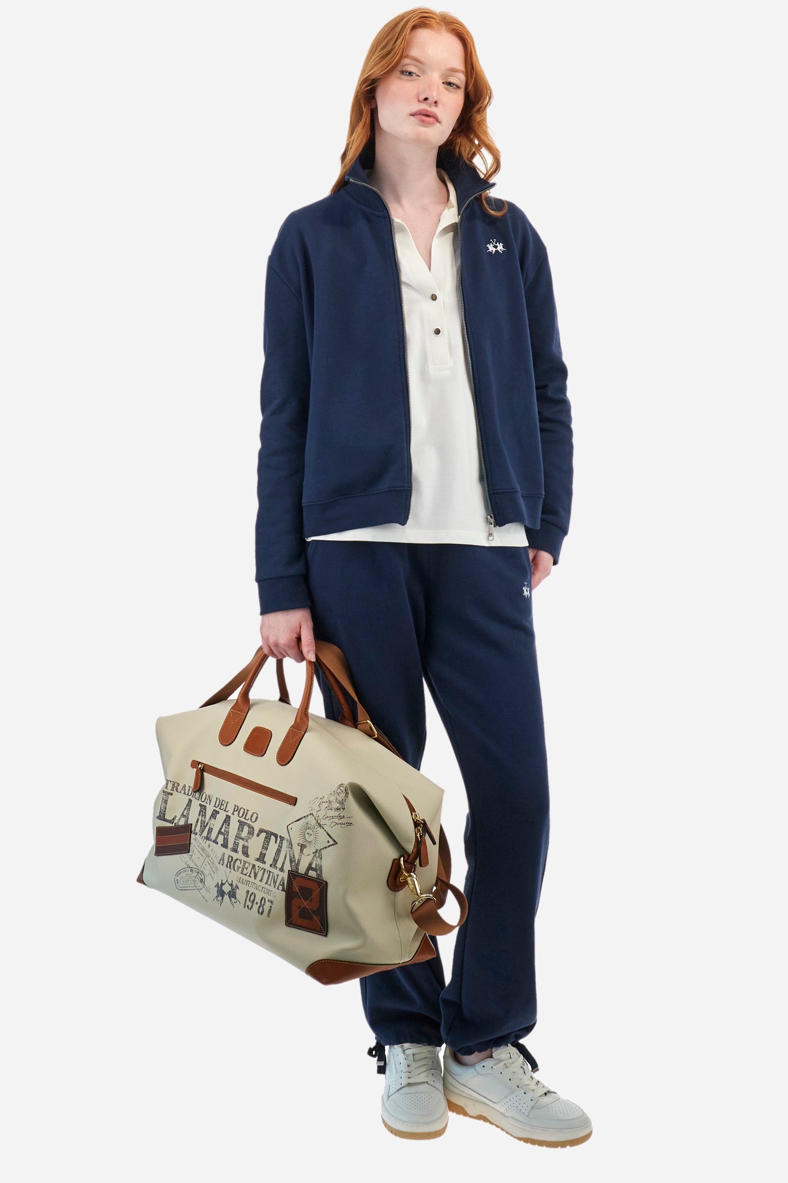 Women's long-sleeved Guards polo shirt, made from plain stretch cotton. V-neckline and two-button fastening. The collar and sleeves are finished with contrasting stripes. The logo and symbol of the capsule collection are embroidered on the front. Regular fit. The model is wearing a size 2. - Off White