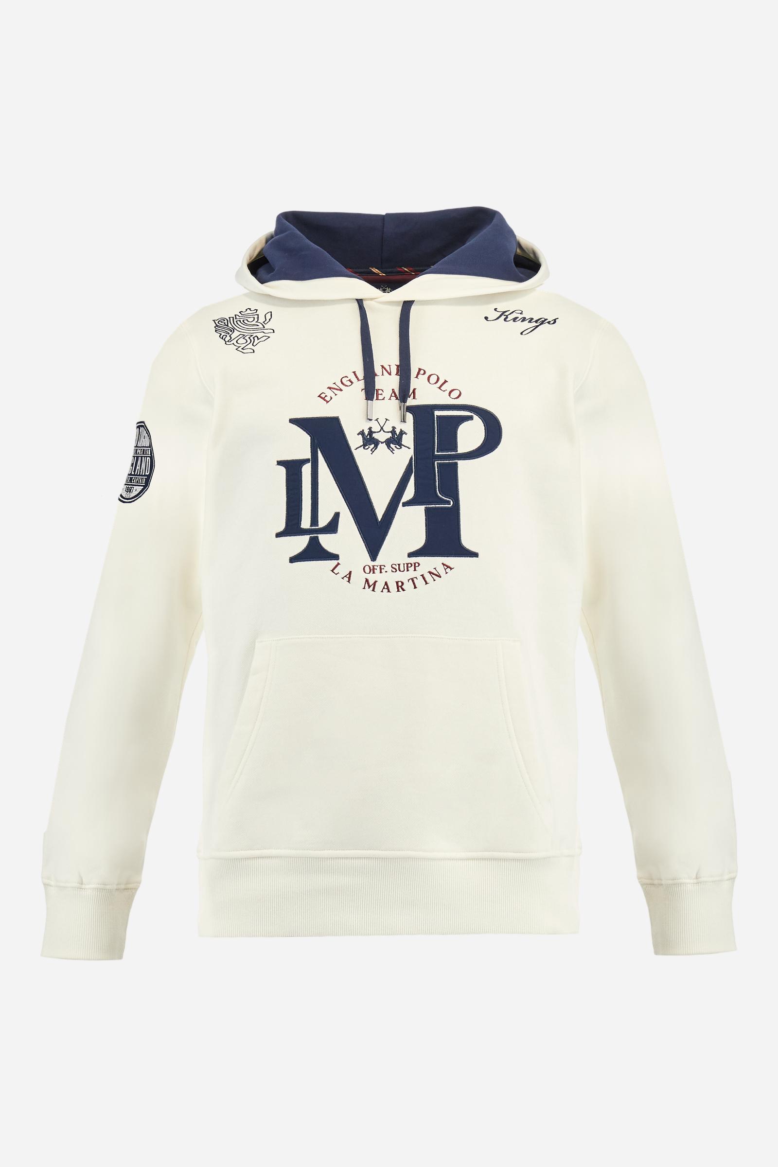Men's long-sleeved hoodie in solid cotton French terry. Features a large kangaroo pocket, hem and cuffs in tone-on-tone rib. Adjustable hood with contrast lining. Chest and sleeves decorated with modern LM monogram graphics inspired by British polo. Contrasting embroidered logo on the chest. Regular fit for a relaxed and comfortable silhouette. Model wears size L. - Off White