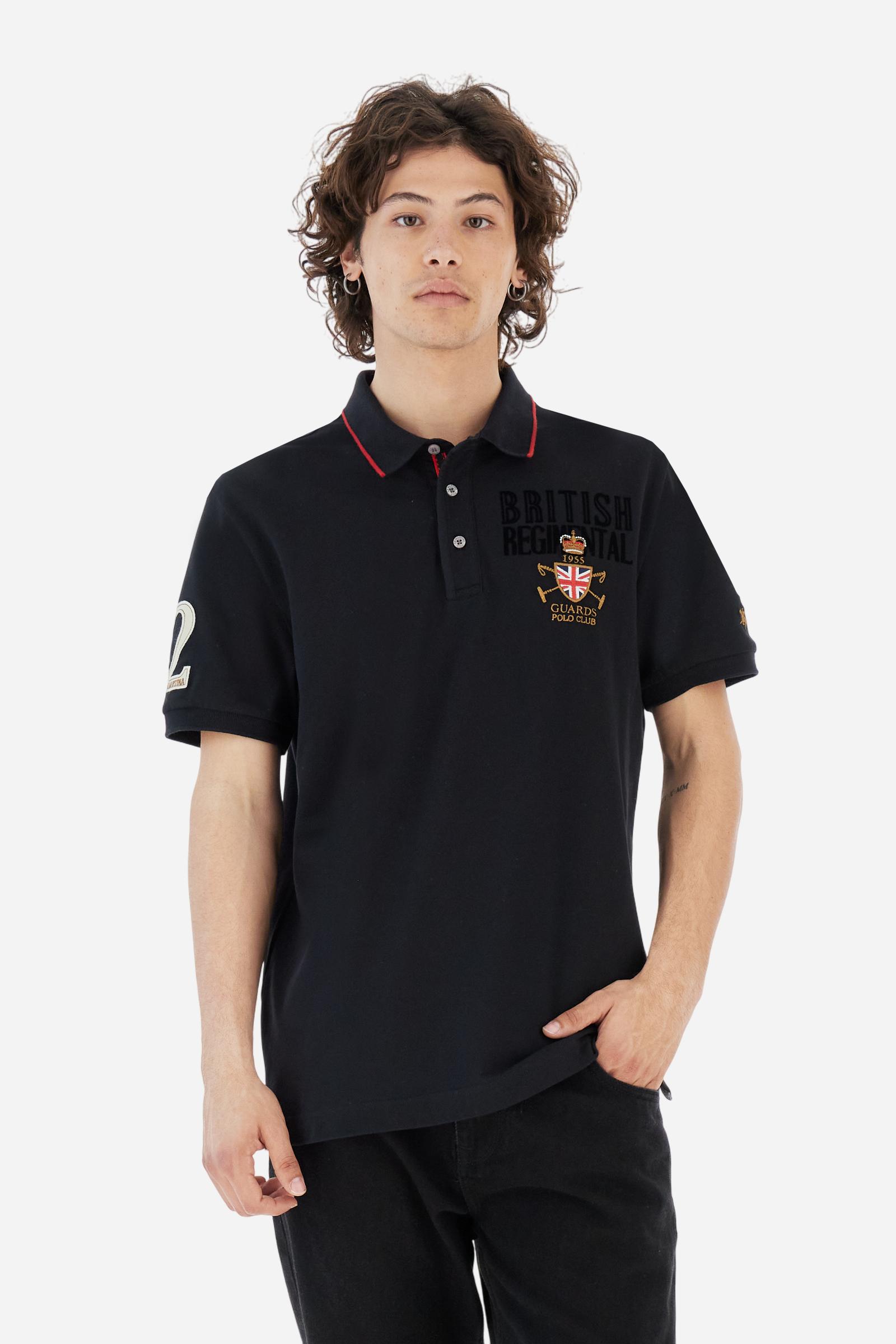Short-sleeve polo shirt from the Guards capsule, made of high-quality stretch cotton piqué. Ribbed collar and cuffs in matching tone, with contrast striped detail on the collar. Three-button personalized placket. Multicolor graphics, patches, and lettering celebrate the British regiment, applied to chest and sleeves. Brand logo embroidered in contrast on the left sleeve. Regular straight fit. Model wears size L. - Black