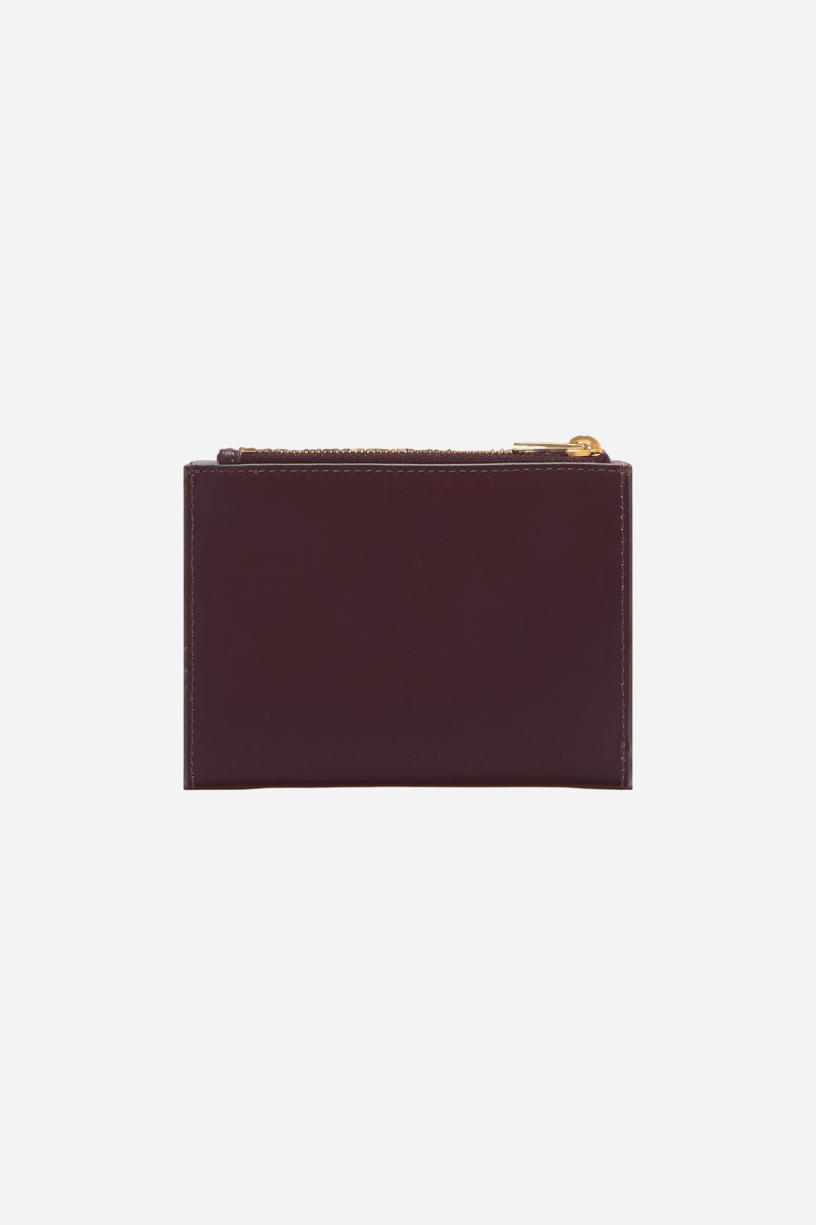 Folding wallet with zip in calfskin leather. Essential and elegant, with front flap and coin pocket. - WINE