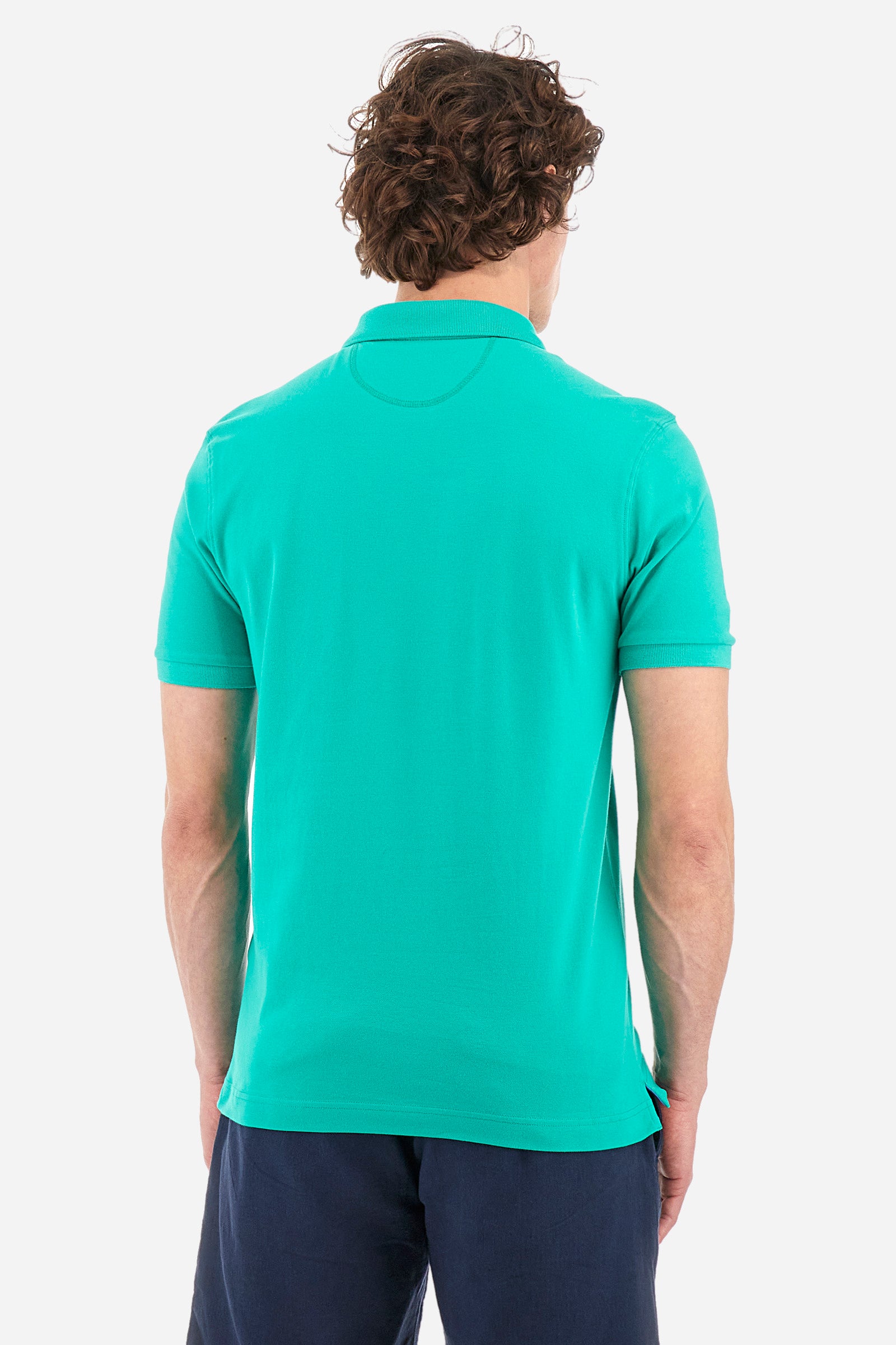 Men's single-colour short-sleeved polo in elasticated cotton. Two-button fastening. Tone-on-tone stitching. Ribbed collar and armholes. The "La Martina" lettering can be found under the collar. Featuring a small logo embroidered on the chest. In a slim fit. The model wears a size L. - Vivid Green