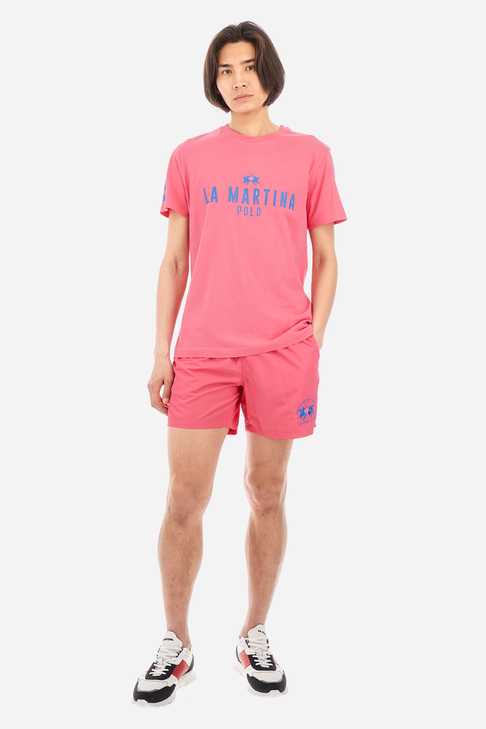 Single-colour men's swimming shorts, made of synthetic fabric. Featuring a drawstring and tie with "La Martina" lettering. Double welt pocket on the front. Closed pocket on the back. Mesh lining. Large logo embroidered on the front. The fit is regular. The model wears a size L. - Hot Pink