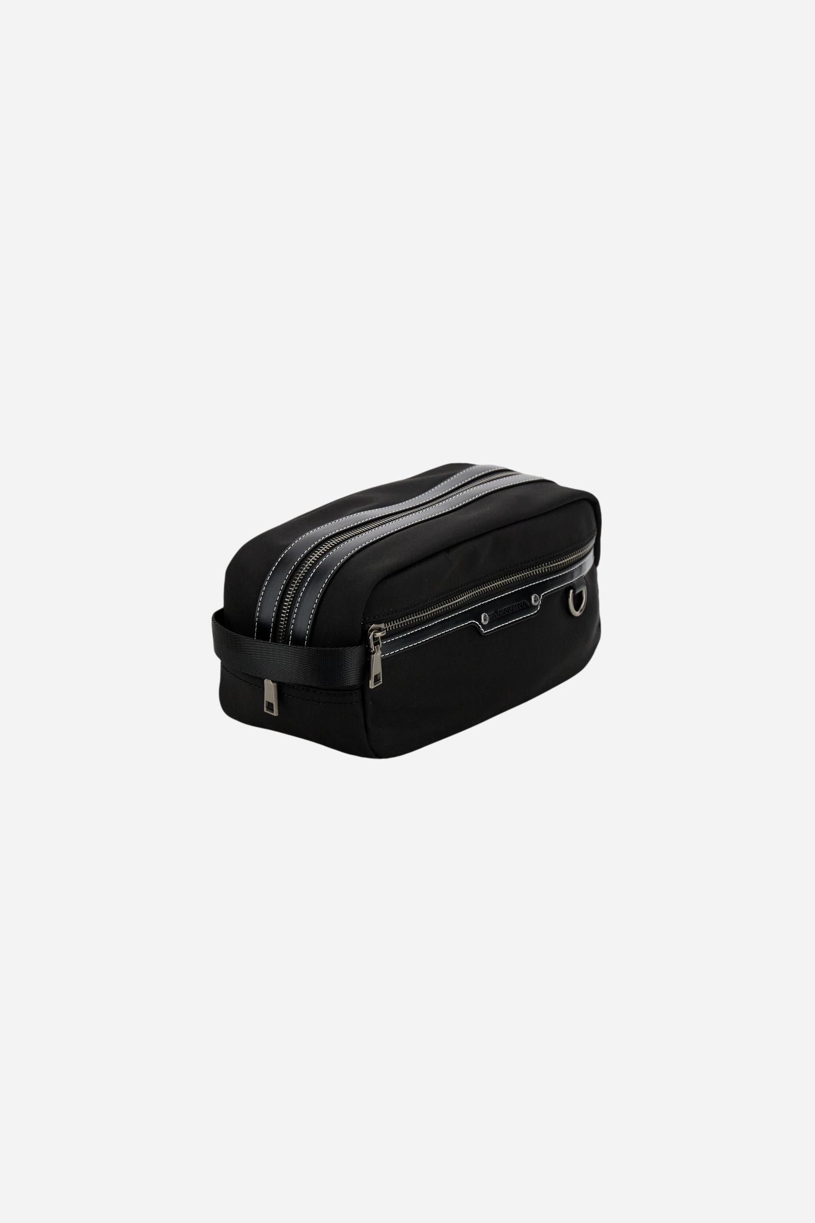 Travel case in matte technical canvas with eco-leather details, double zip compartment and maxi logo on the front. - Black