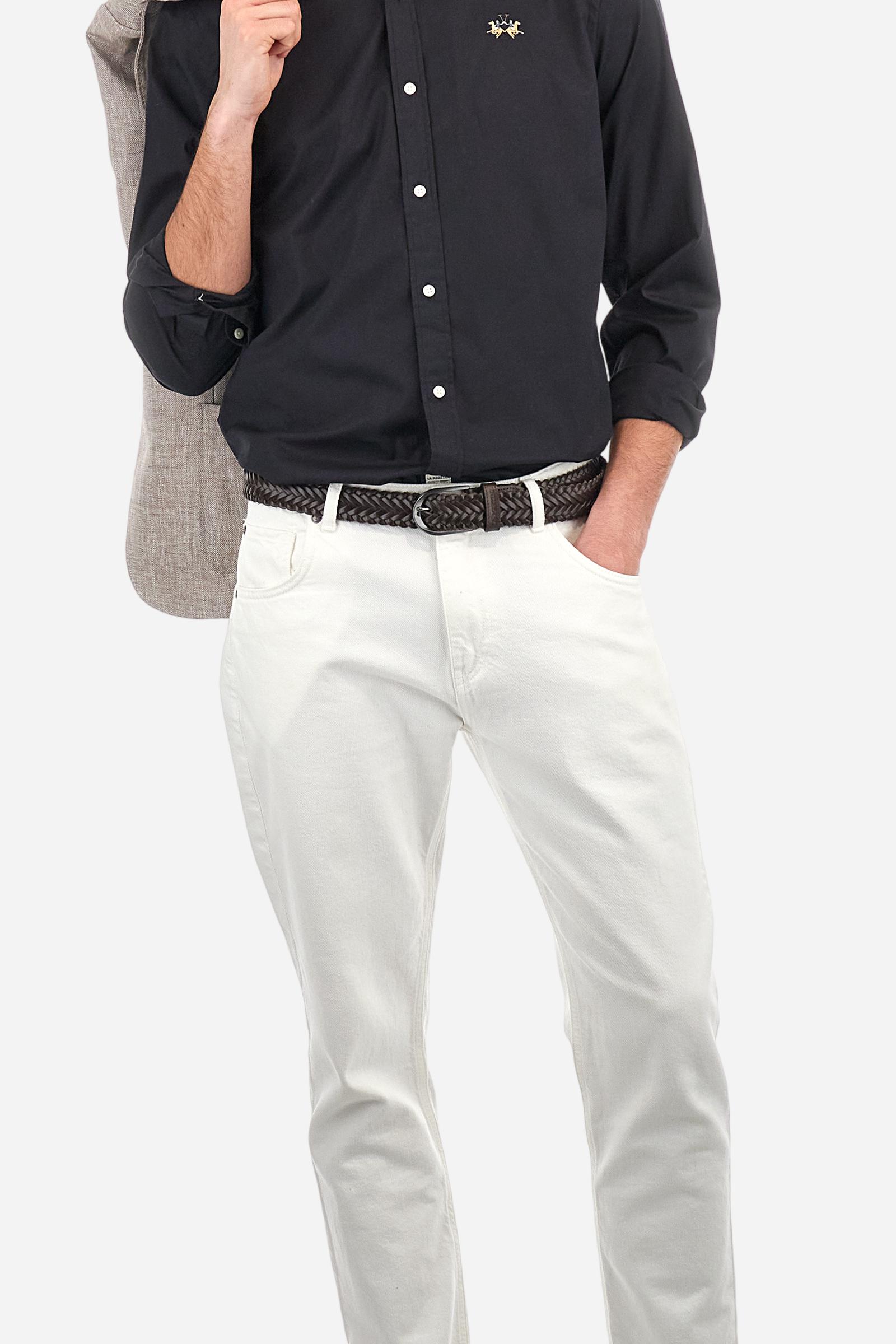 Men's plain long-sleeved shirt made from stretch cotton poplin for a comfortable fit. Featuring a button-down collar and woven labels at the bottom of the opening. A multicoloured logo is embroidered on the chest, over the heart, in contrasting thread. The slim fit ensures a sleek and modern look. The model is wearing a size L. - Black