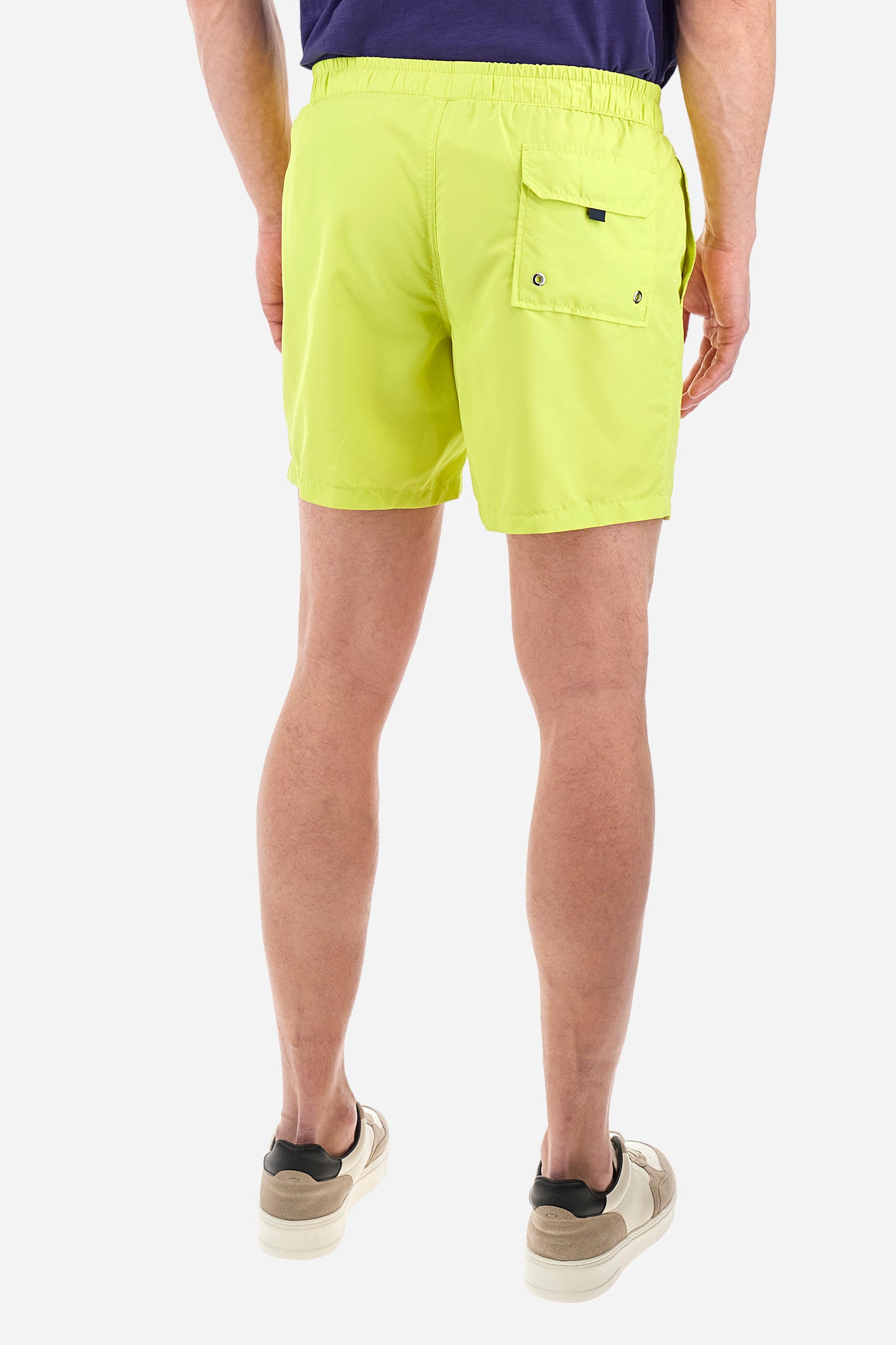 Single-colour men's swimming shorts, made of synthetic fabric. Featuring a drawstring and tie with "La Martina" lettering. Double welt pocket on the front. Closed pocket on the back. Mesh lining. Large logo embroidered on the front. The fit is regular. The model wears a size L. - Acacia
