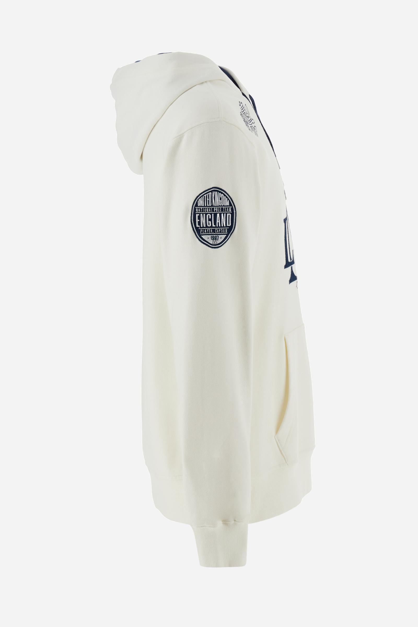 Men's long-sleeved hoodie in solid cotton French terry. Features a large kangaroo pocket, hem and cuffs in tone-on-tone rib. Adjustable hood with contrast lining. Chest and sleeves decorated with modern LM monogram graphics inspired by British polo. Contrasting embroidered logo on the chest. Regular fit for a relaxed and comfortable silhouette. Model wears size L. - Off White