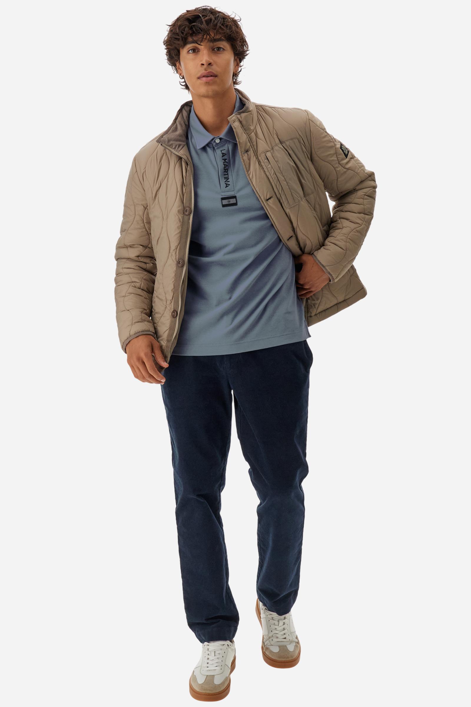 Premium men’s long-sleeve polo shirt in 100% cotton jersey with a smooth, silky texture. Hidden button placket and vertical contrast print. Patches dedicated to the Asociación Argentina de Polo (AAP) on the sleeve and below the opening. Small semi-transparent contrasting logo printed on the chest. Regular fit. The model wears size L. - Flint Stone