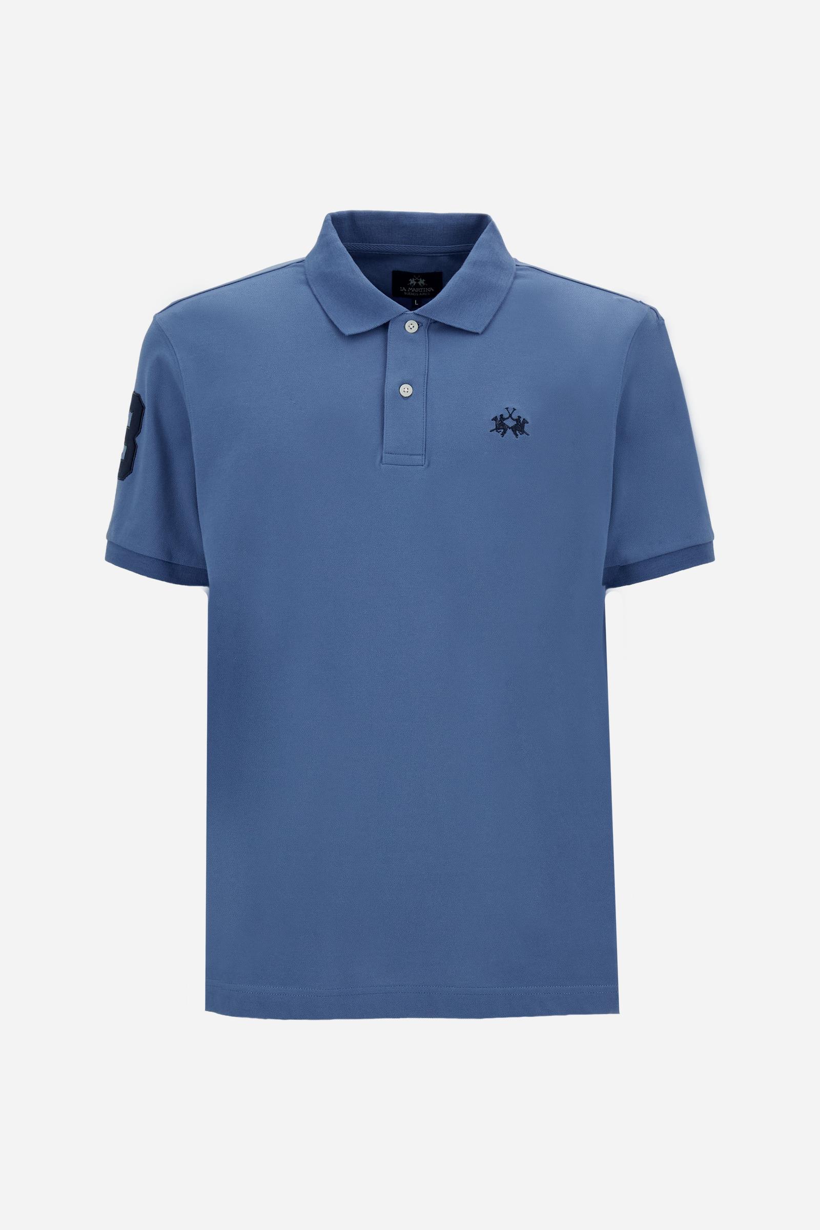 Men’s short-sleeve stretch piqué polo. Two-button placket and ribbed details, with a regular fit. Iconic style characterised by applied logo and patches. - Riviera