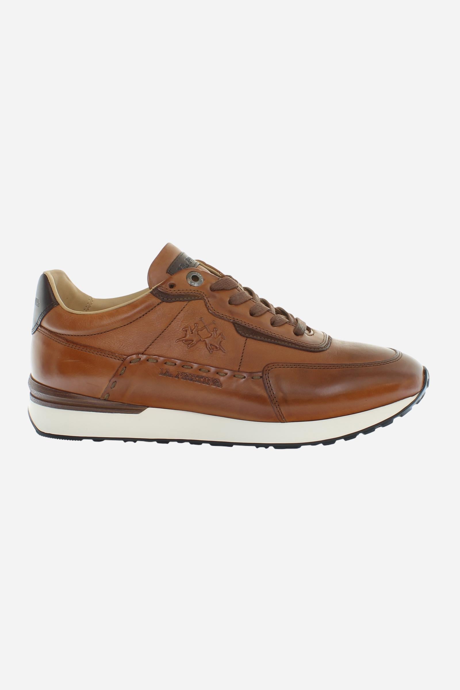 Sporty and elegant leather trainers with ultralight technical soles in XL Extralight EVA. Perfect for anyone in search of comfort, performance and handcrafted details. - COGNAC