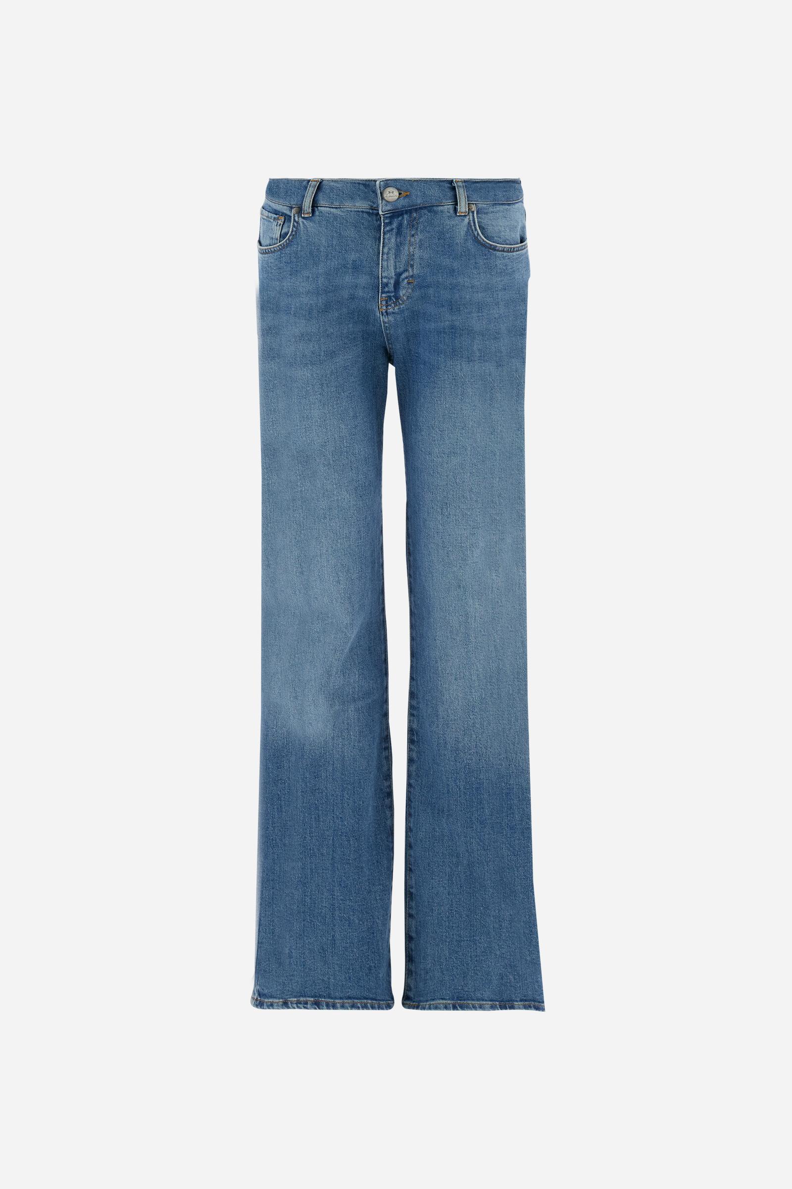 Women's stretch denim jeans. Classic 5-pocket style with regular fit and cigarette legs. The jacron label is applied to the back of the waistband, where the brand logo appears. The model is wearing a size 28. - Medium Indigo Denim