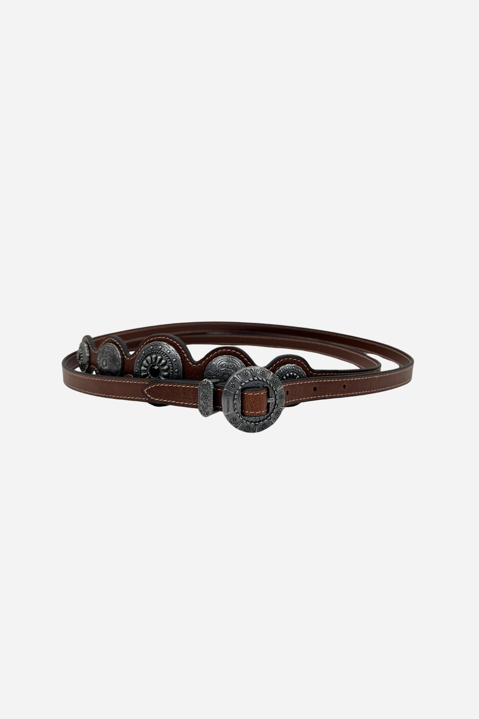 Full-grain leather women's belt with a unique wavy edge, adorned with engraved South American-inspired metal conchos and an antique-finished round buckle. - Cherry Mahogany