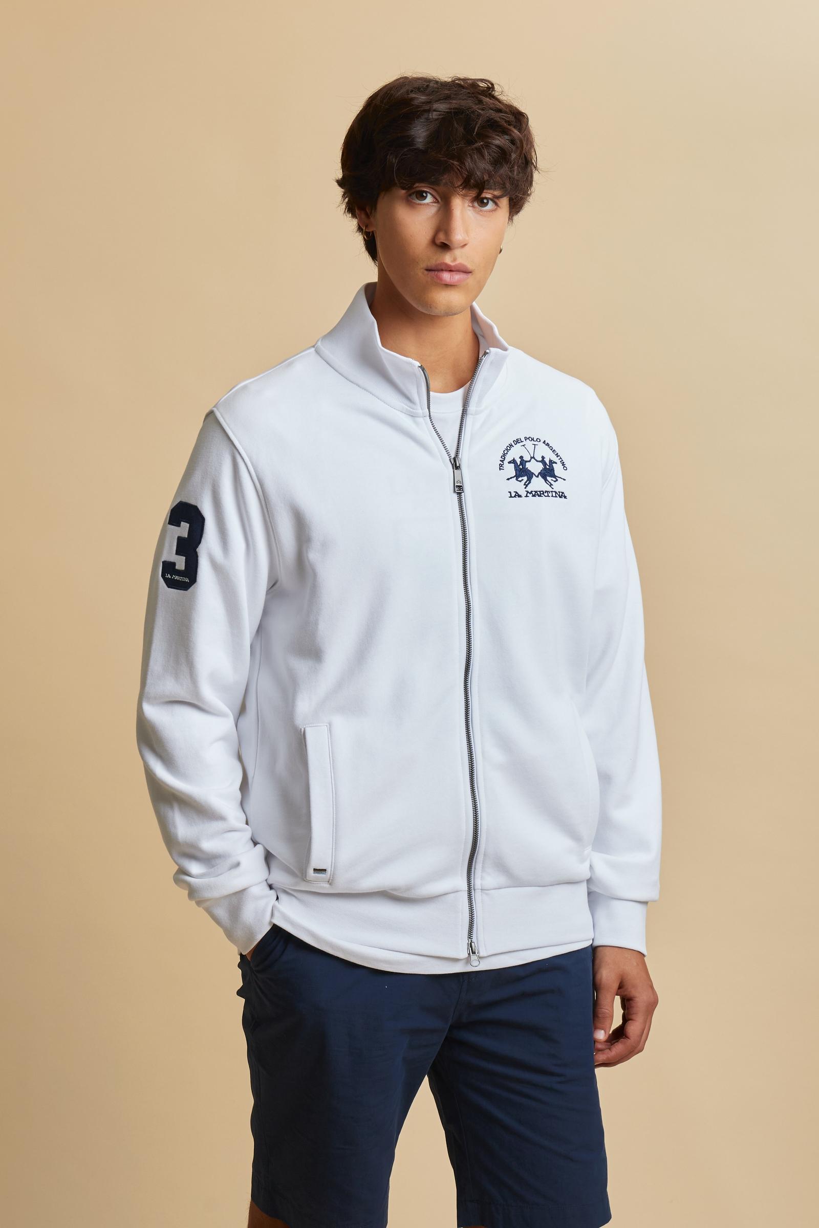 Men’s long sleeve sweatshirt made of lightweight non-brushed 100% cotton fleece for breathability and comfort. High neck with full front opening and personalized zip. Ribbed collar tone-on-tone with multicolor vertical stripes at the back, ribbed cuffs and hem. Clean design enriched with iconic details: contrast applied number 3 patch on the sleeve and large contrast embroidered team logo on the chest. Regular fit. The model wears size L. - Optic White