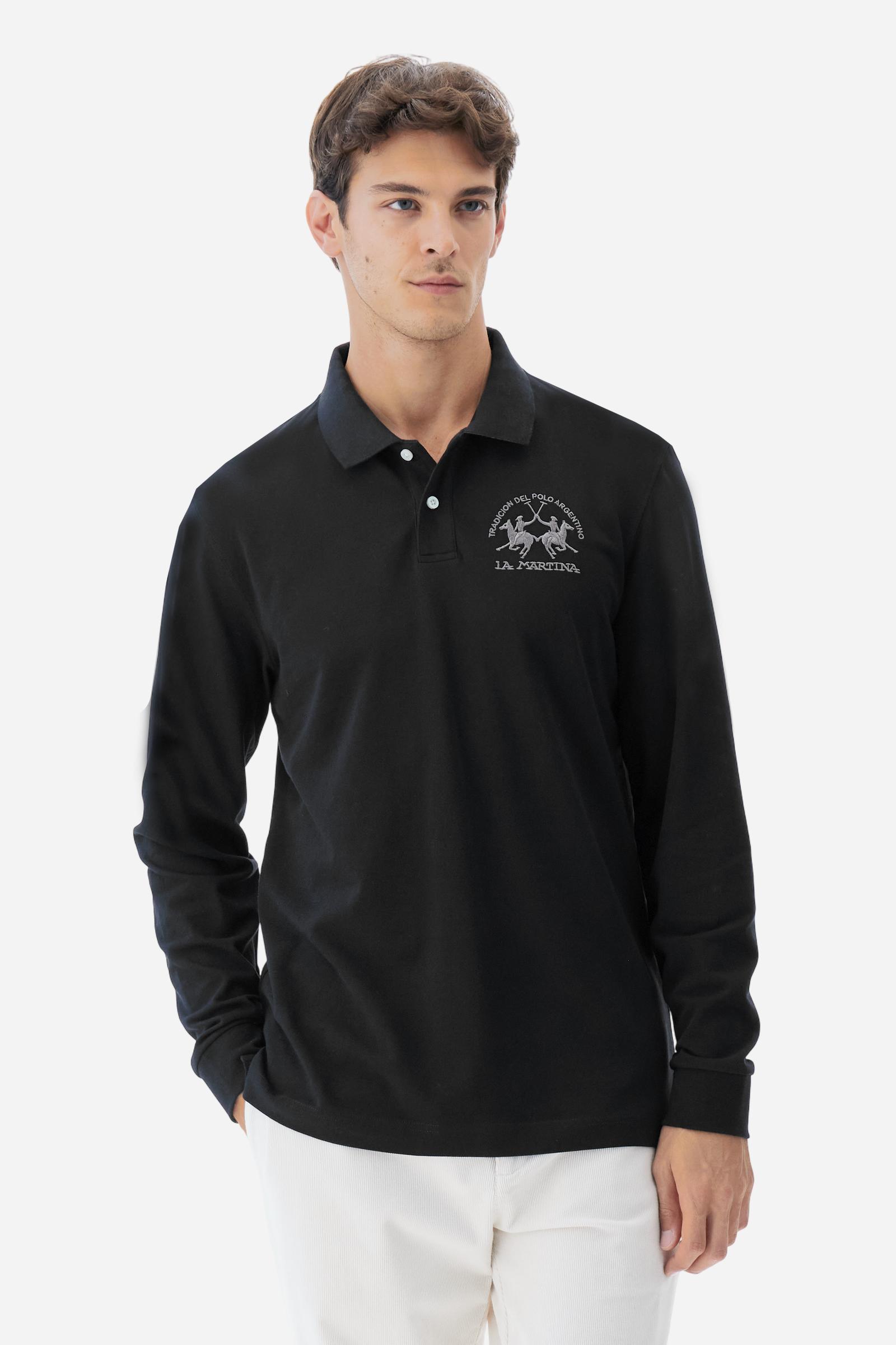 Men's long-sleeved solid colour polo shirt. Made of high-quality stretch Piqué. The collar and cuffs are in solid colour ribbing. The undercollar features a print of the iconic La Martina lettering in a contrasting colour. Featuring a logo embroidered on the chest in a contrasting colour. On the back at the bottom, the guarantee label typical of the brand's iconic models is applied. Regular fit. The model is wearing a size L. - Black