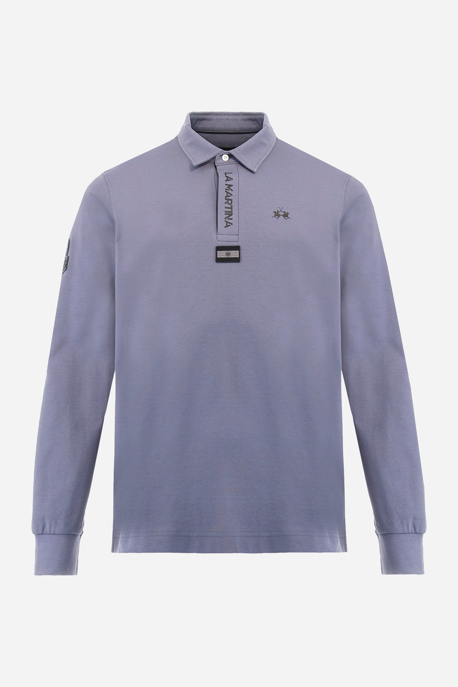 Premium men’s long-sleeve polo shirt in 100% cotton jersey with a smooth, silky texture. Hidden button placket and vertical contrast print. Patches dedicated to the Asociación Argentina de Polo (AAP) on the sleeve and below the opening. Small semi-transparent contrasting logo printed on the chest. Regular fit. The model wears size L. - Flint Stone