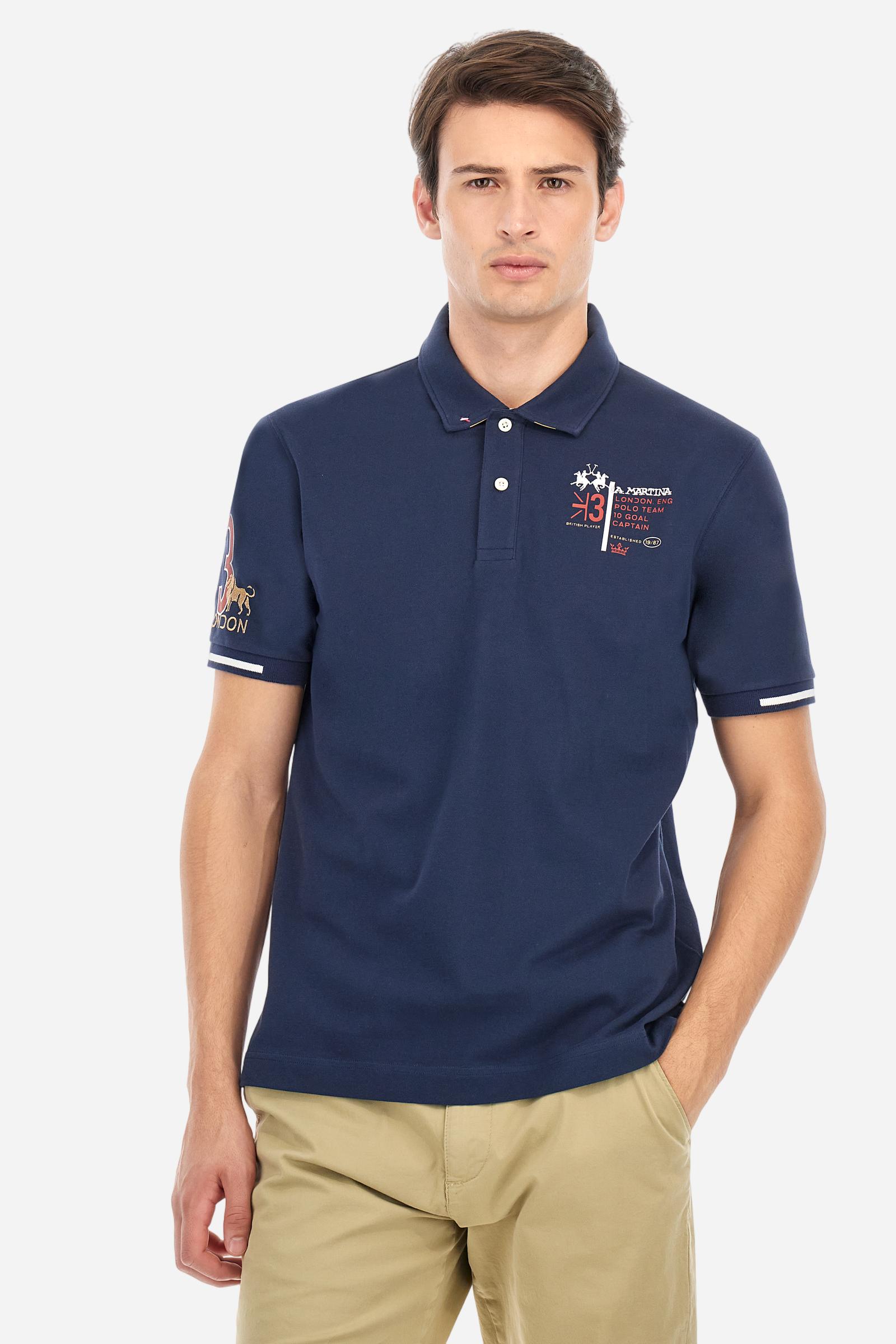 Short-sleeved, single-colour men's polo shirt made of stretch cotton piqué. Fastens with two buttons and internal opening, button side, in contrasting fabric. Ribbed collar and cuffs. The cuffs feature an inlaid detail in a contrasting colour. The graphics on the chest and back are made with mixed techniques: printing and embroidery. The logo is embroidered on the chest, left side. The fit is regular. The model is wearing a size L. - Navy