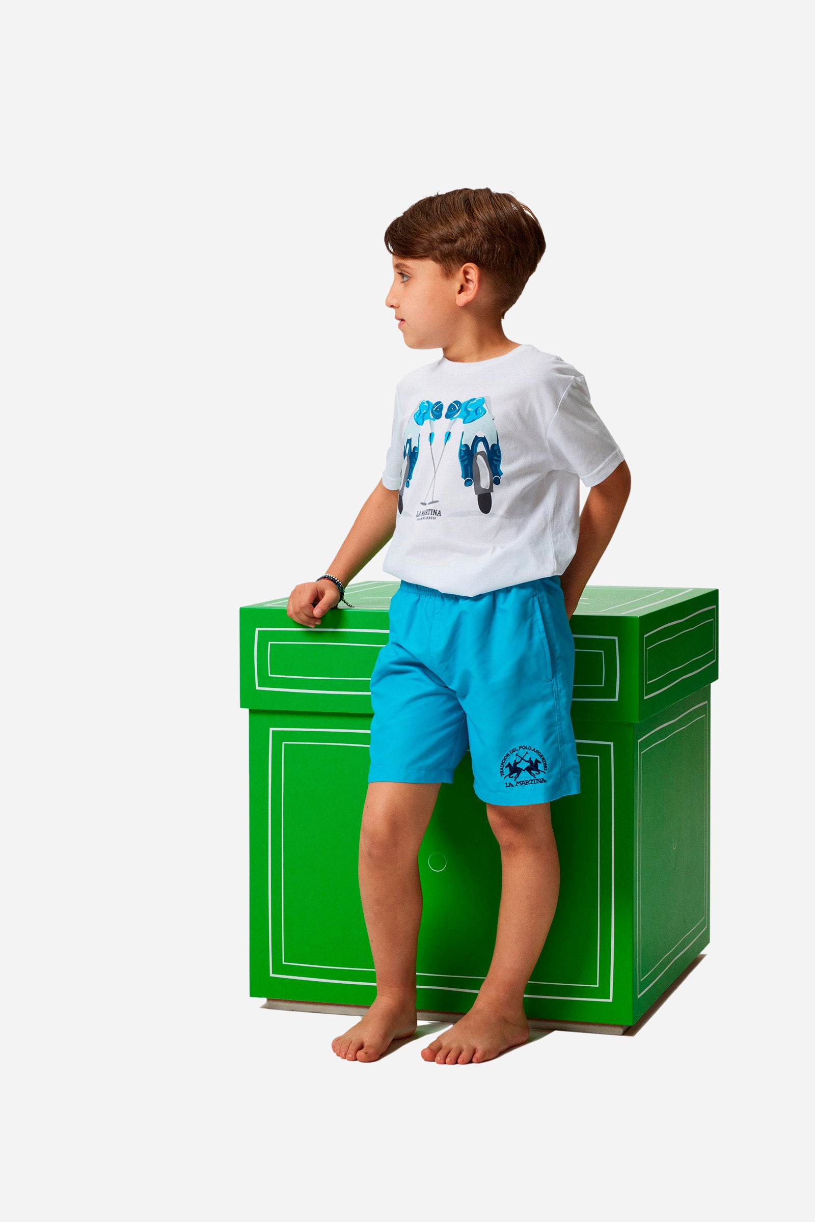 Boys' single-colour costume in synthetic fabric with elasticated waist, front slanted pockets, a contrasting back pocket, and embroidered logo. - Blue Atoll