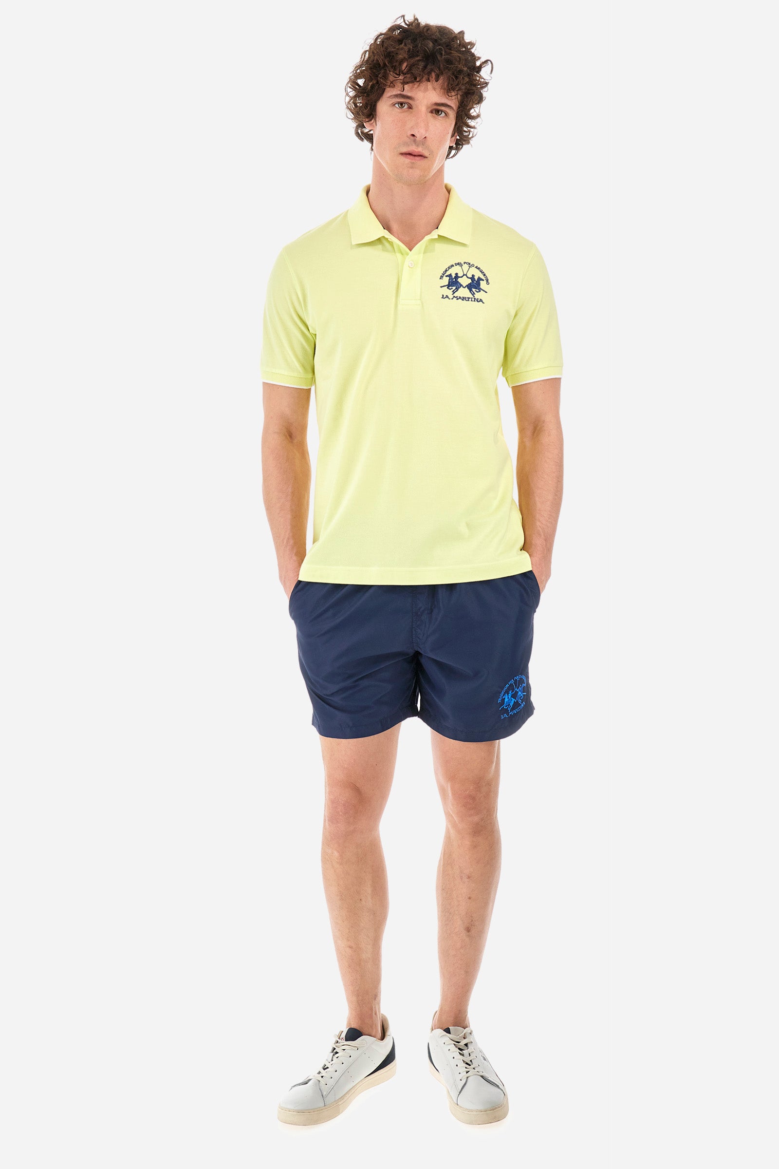 Single-colour men's swimming shorts, made of synthetic fabric. Featuring a drawstring and tie with "La Martina" lettering. Double welt pocket on the front. Closed pocket on the back. Mesh lining. Large logo embroidered on the front. The fit is regular. The model wears a size L. - Navy