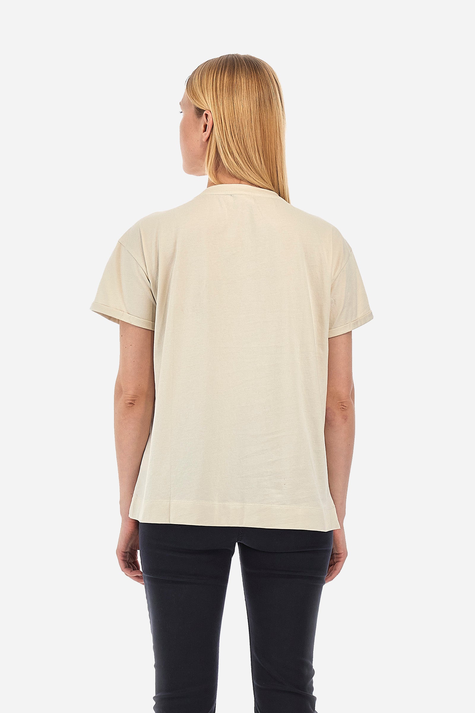 Women's short-sleeved T-shirt with a crew neck in a single colour from the Polo Academy line. Made of 100% cotton. There is a slight turn-up on the sleeve. The front features the La Martina logo and lettering and some of the symbols of the Polo Academy line, all tone on tone. The T-shirt is embellished with all-over tone-on-tone rhinestone applications. The fit is regular. The model wears a size 2. - Bone White