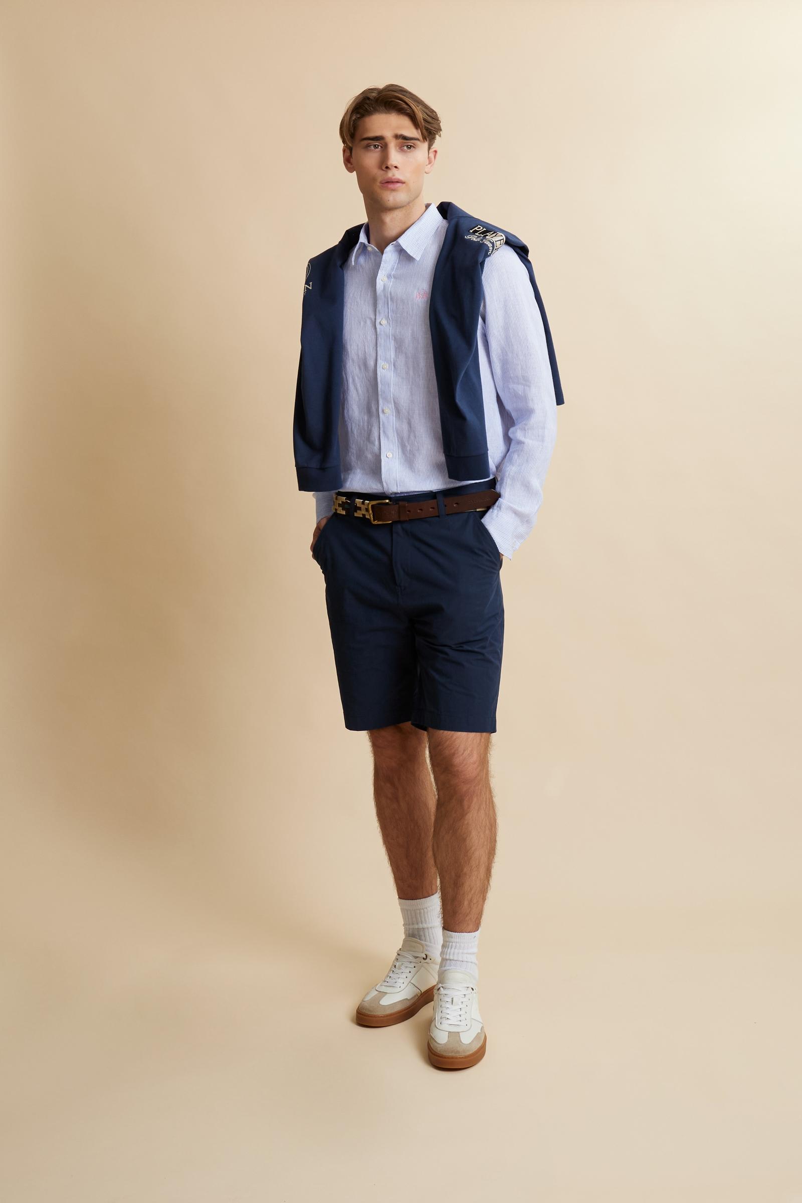 Shirt in 100% linen with vertical micro stripes and natural slub texture. Regular fit that follows the body. Embroidered logo on the chest and signature details on the placket. - OptWhitePrincessBlue