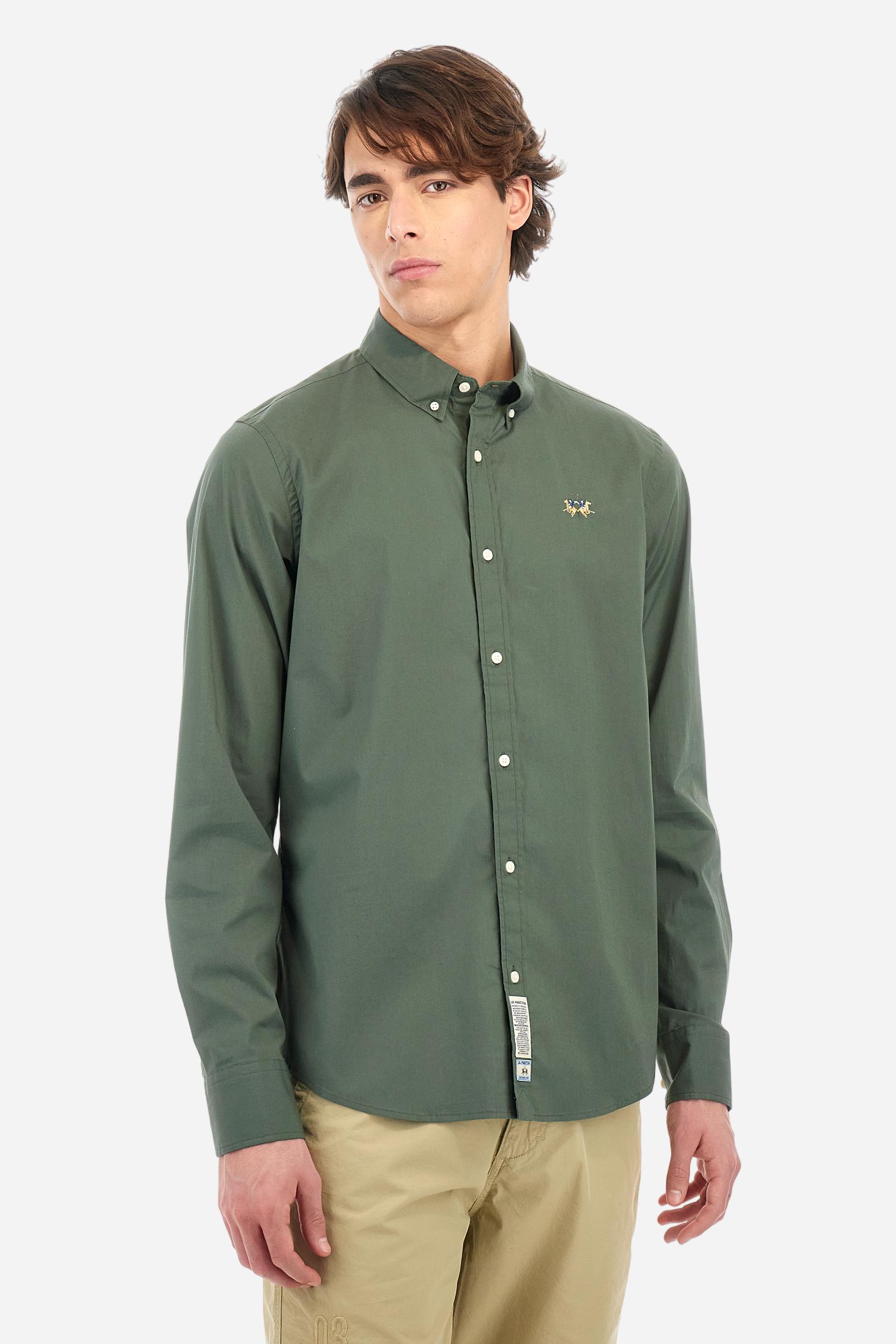 Men's plain long-sleeved shirt made from stretch cotton poplin for a comfortable fit. Featuring a button-down collar and woven labels at the bottom of the opening. A multicoloured logo is embroidered on the chest, over the heart, in contrasting thread. The slim fit ensures a sleek and modern look. The model is wearing a size L. - Thyme