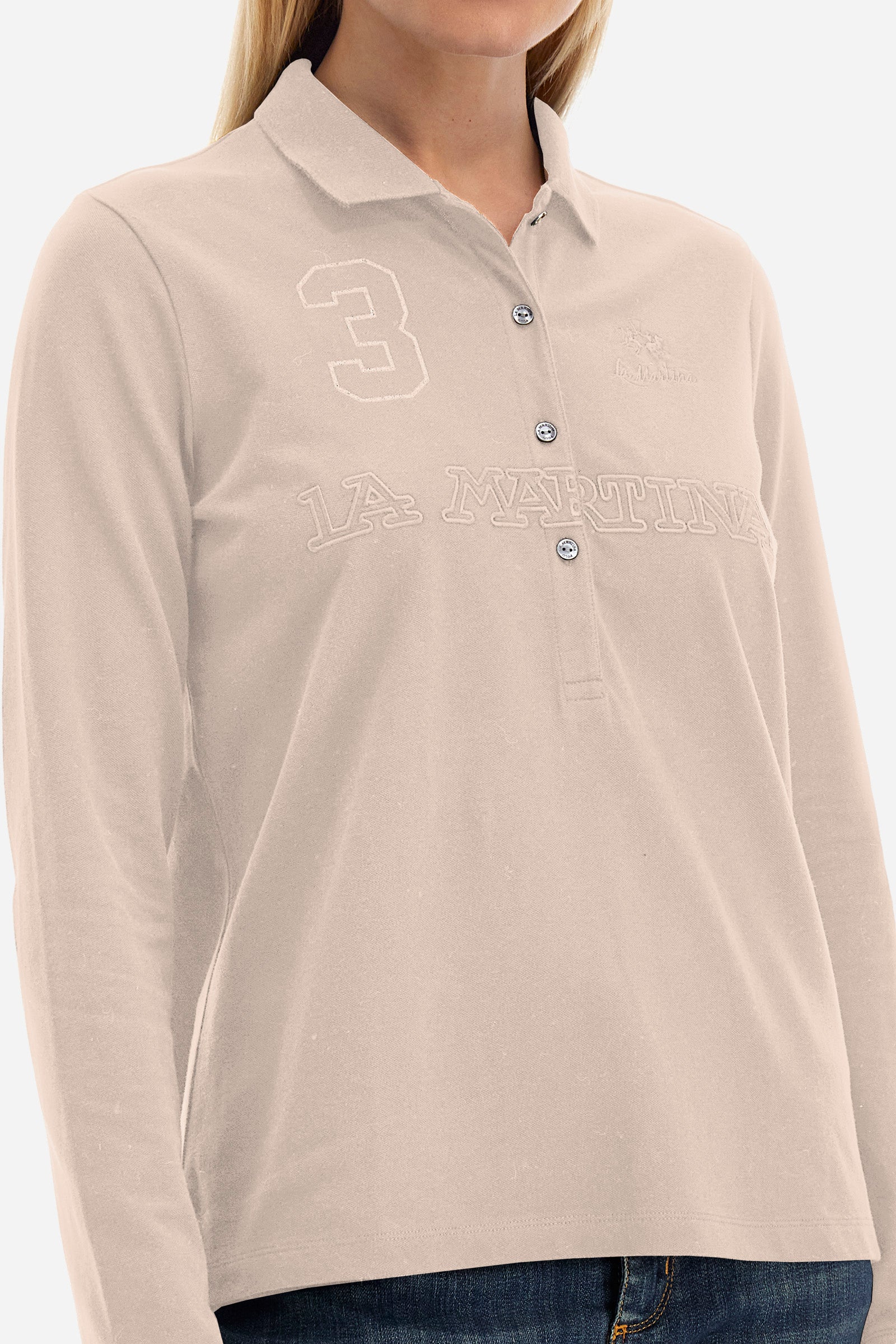 This women's polo shirt from the Timeless line is made of stretch cotton and has a regular fit. Available in a wide range of colours, it is perfect for those looking for a simple but quality garment. The solid colour and the embossed print of the La Martina logo on the front, together with the number 3, make it an elegant and unique garment. The classic 4-button collar completes the ideal look for a casual or sporty outfit. The model is 174 cm tall and wears a size 2. - Tillandsia Purple