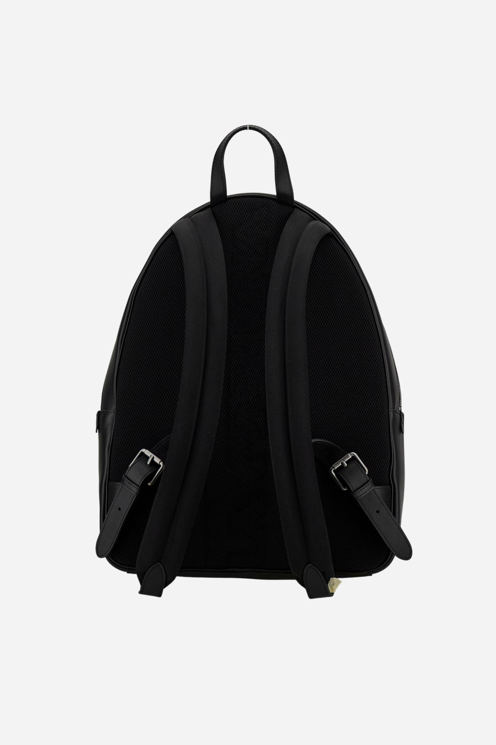 Urban backpack in calfskin leather. Elegant and practical, with front zip pocket and metallic details. - Black