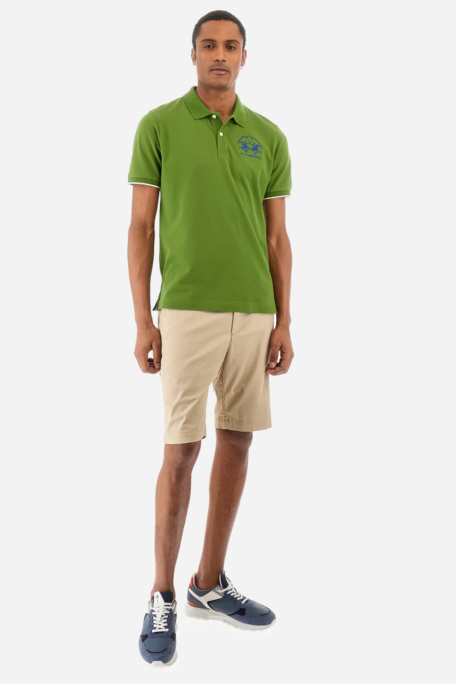 Men’s polo with short sleeves, regular fit. Made of stretch pique cotton. Classic model, with large embroidered logo in contrasting tone on the chest and profiled sleeve edges. The collar is accompanied by the writing La Martina, in contrasting tone. Ideal if worn with a denim collection. The model wears a size L. - Cactus