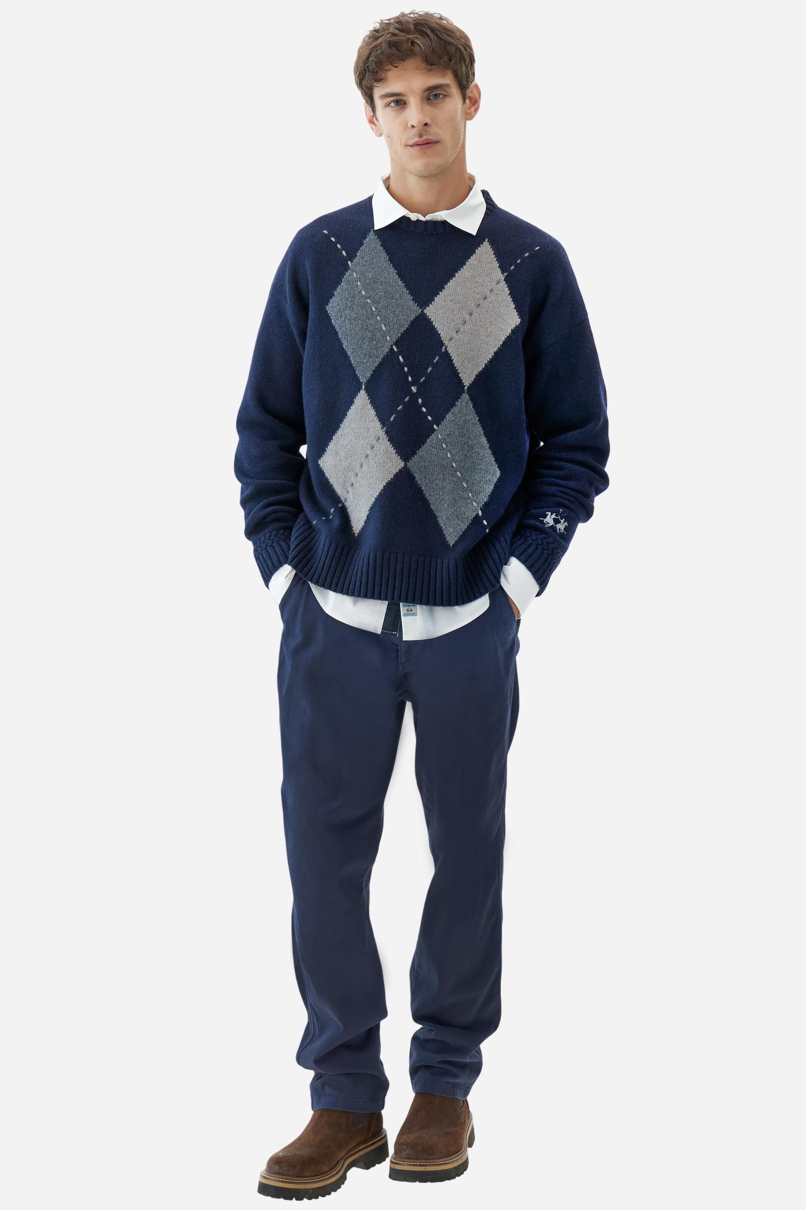 Men’s crew-neck sweater with long sleeves in high-quality wool blend. Ribbed collar, cuffs and hem with zigzag detail at sleeve attachment. Argyle motif on the front and contrast embroidered logo on the cuff. Regular fit with dropped shoulders for a contemporary look. The model wears size L. - Navy